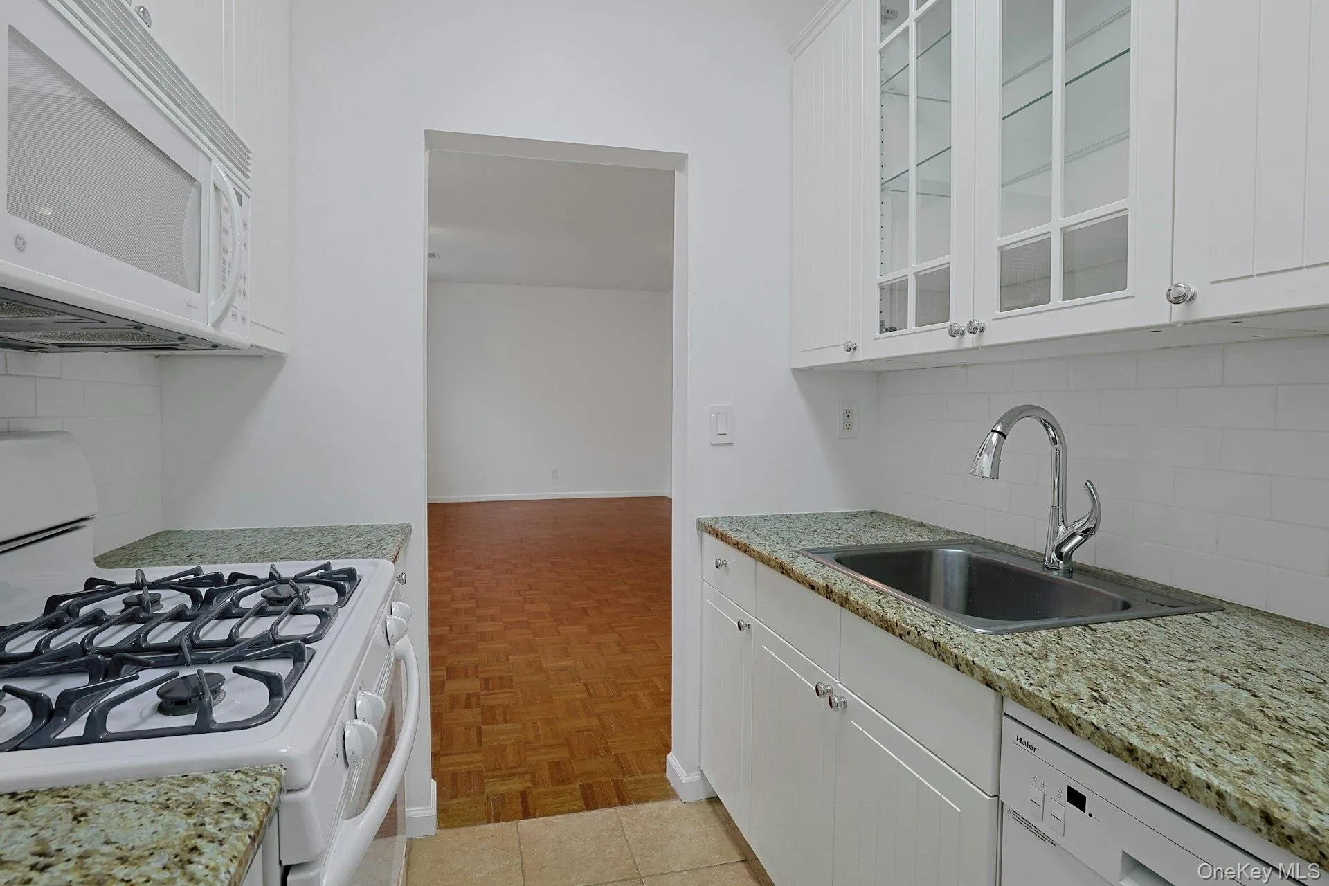View of kitchen into living area. View of kitchen into living area.