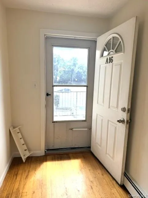 Entry with hardwood flooring Entry with hardwood flooring