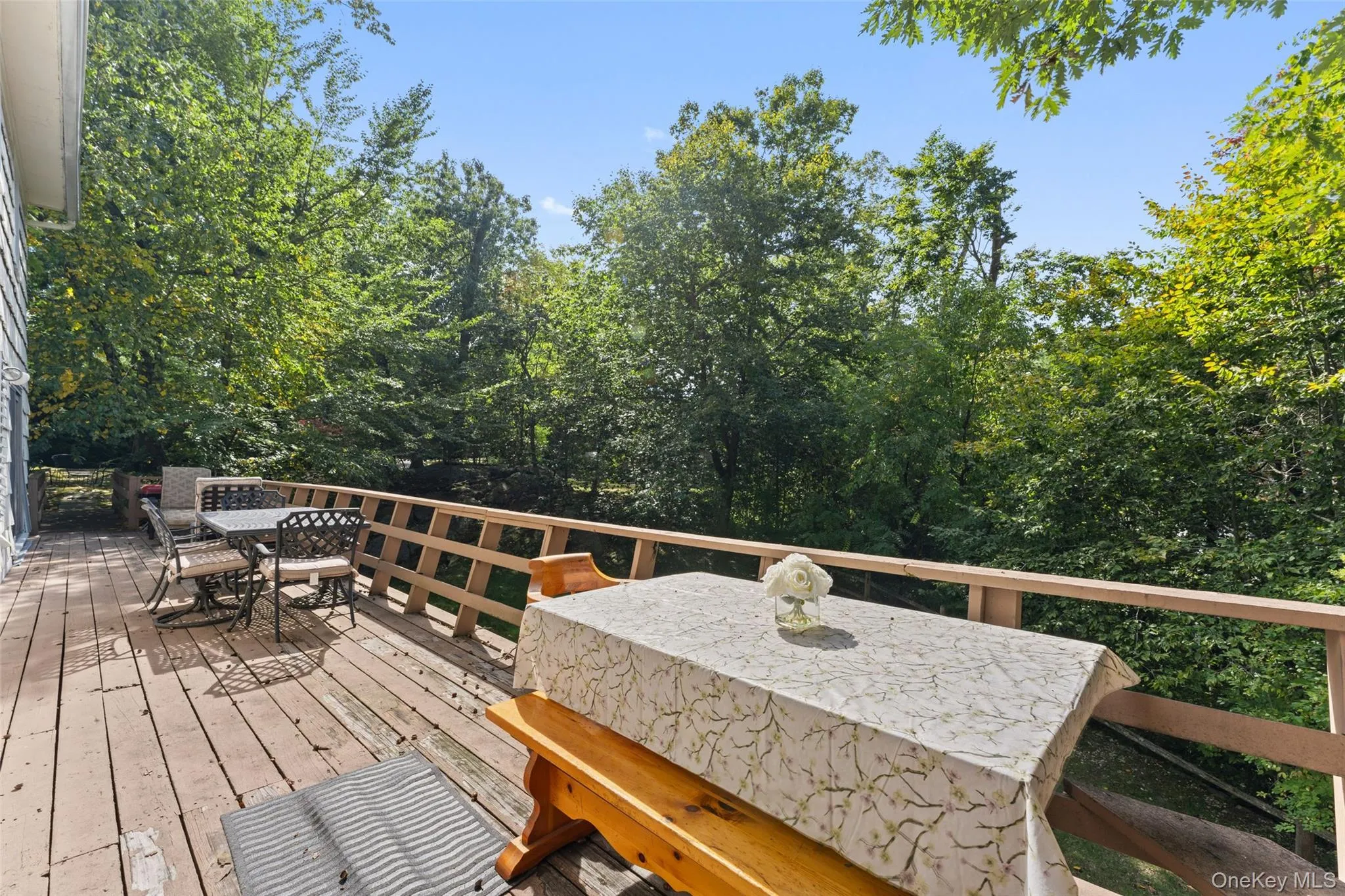 Expansive wood deck with a perimeter railing. Expansive wood deck with a perimeter railing.