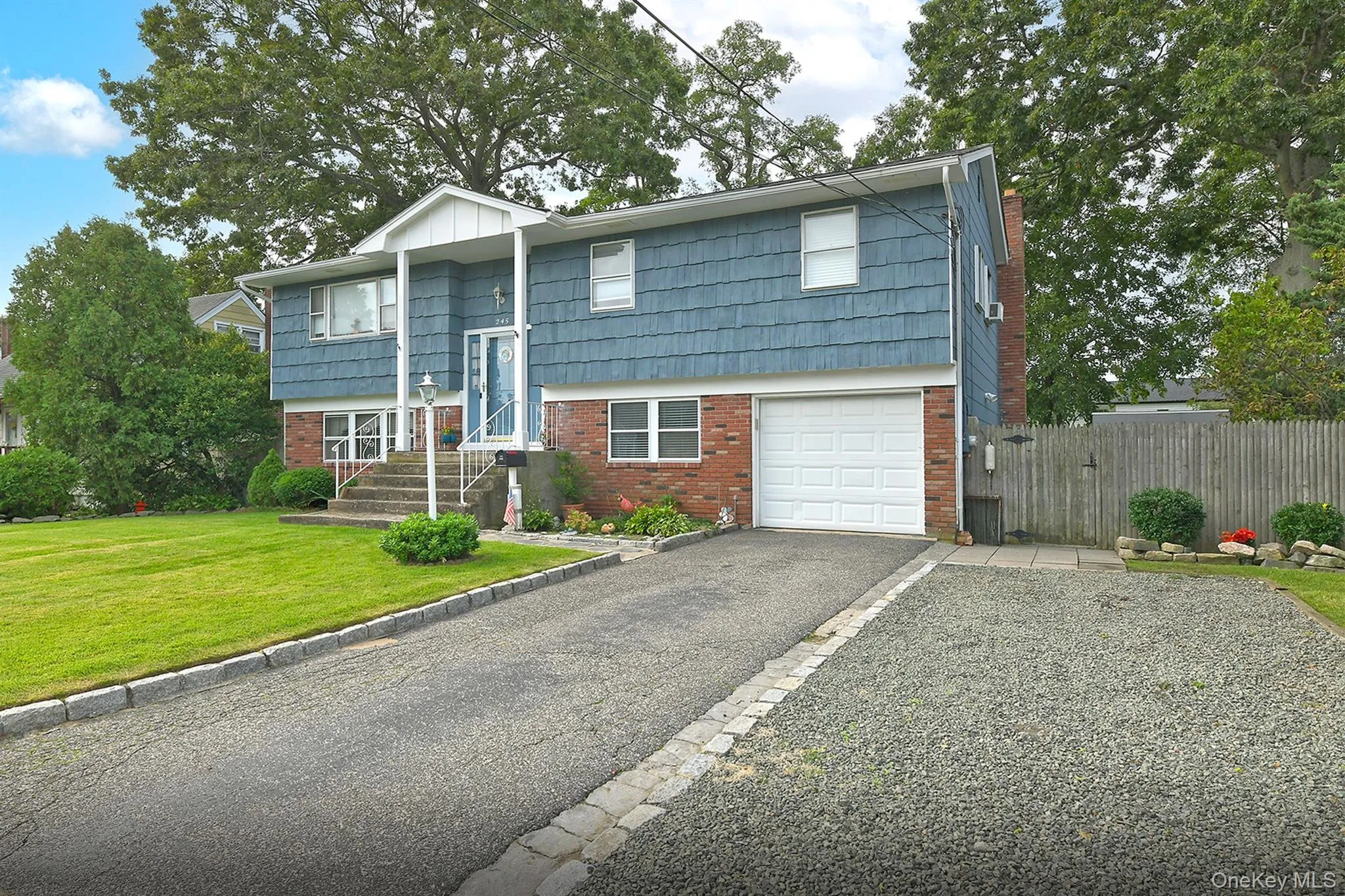 Front View with Extended Oversize Driveway and 1 Car Garage Front View with Extended Oversize Driveway and 1 Car Garage