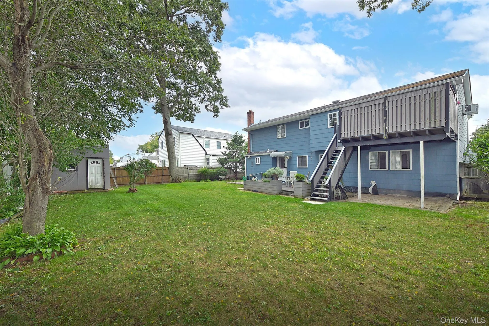Fenced Rear Yard with Trex Decks, Patios & large Shed Fenced Rear Yard with Trex Decks, Patios & large Shed