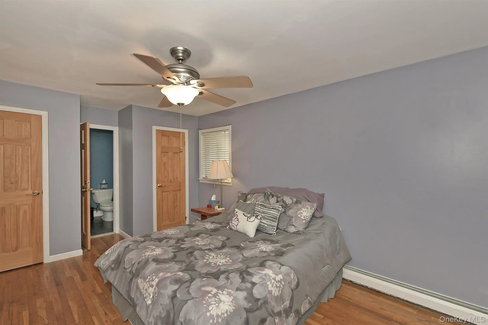 Master Bedroom with door leading into bathroom, HW Floors & Solid Oak Doors Master Bedroom with door leading into bathroom, HW Floors & Solid Oak Doors