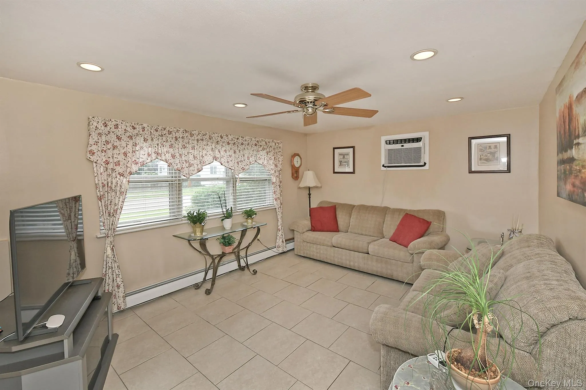 Lower Level Living Room, Recessed Lighting, Ceiling Fan +Tiled Floors Lower Level Living Room, Recessed Lighting, Ceiling Fan +Tiled Floors