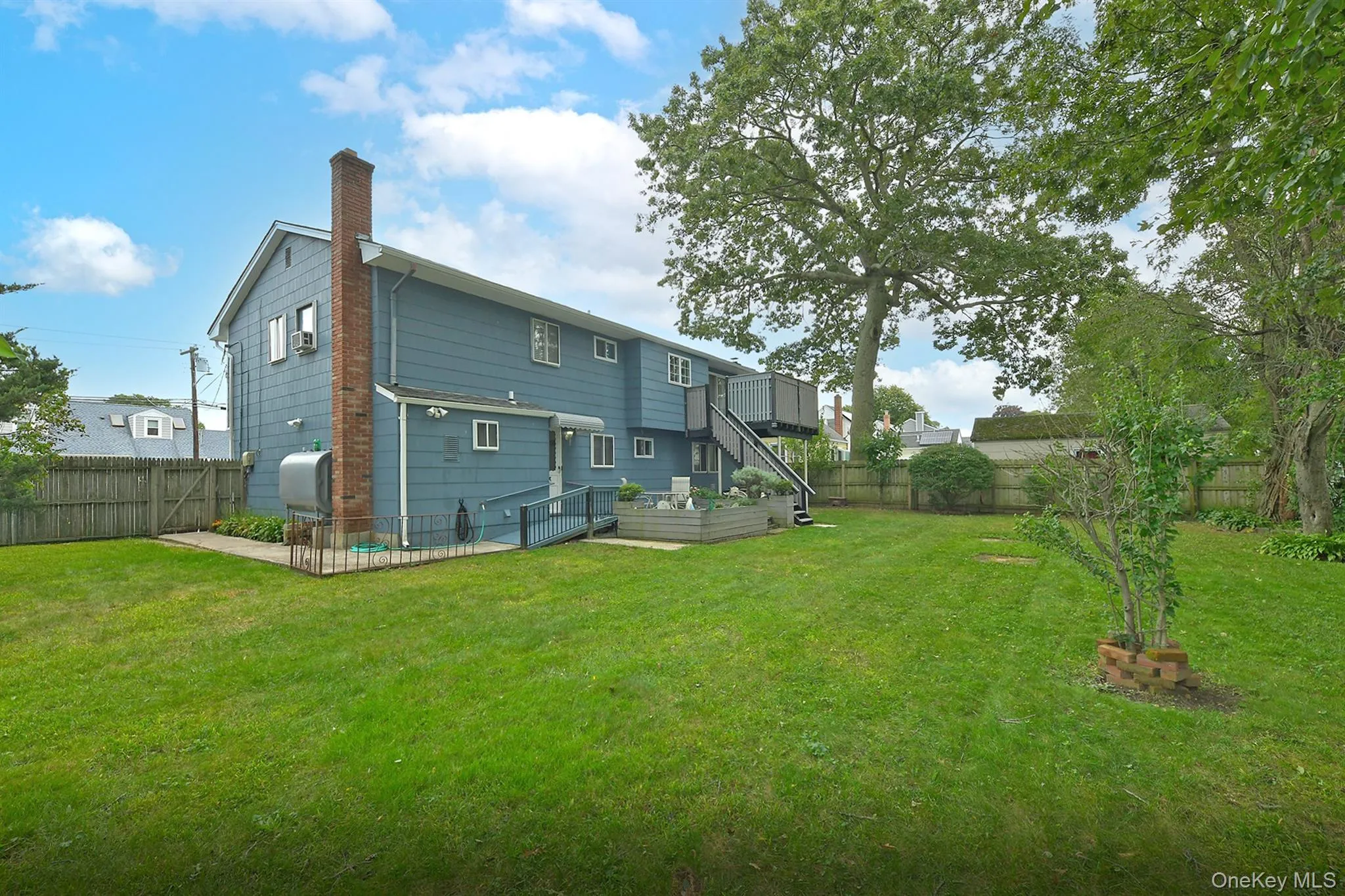 Rear Yard with Rear Ramp, Walkway, Trex Decks & Paios Rear Yard with Rear Ramp, Walkway, Trex Decks & Paios
