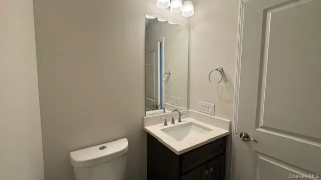 Bathroom featuring vanity and toilet Bathroom featuring vanity and toilet