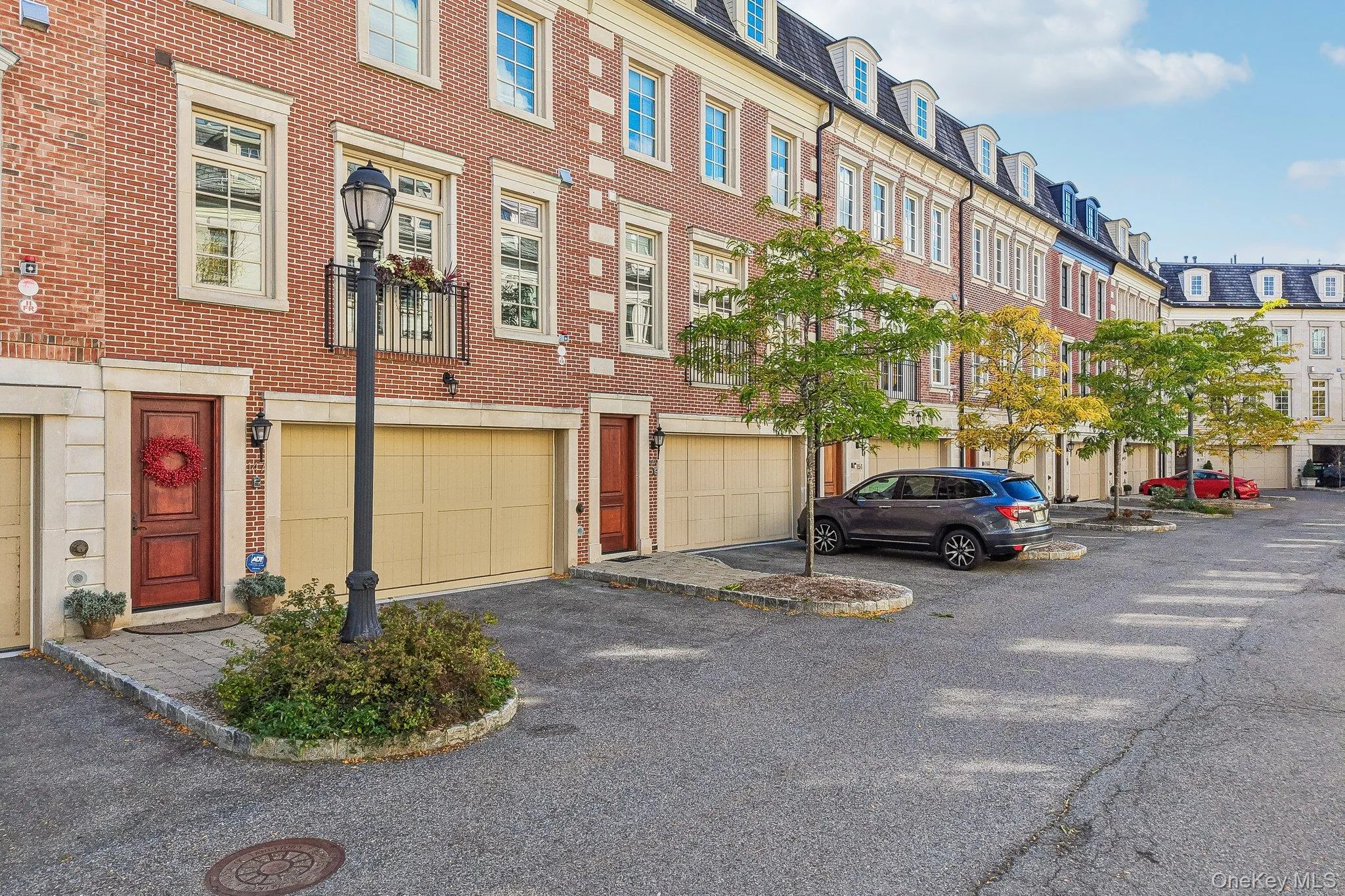 Two car garage with two additional parking spaces behind Two car garage with two additional parking spaces behind