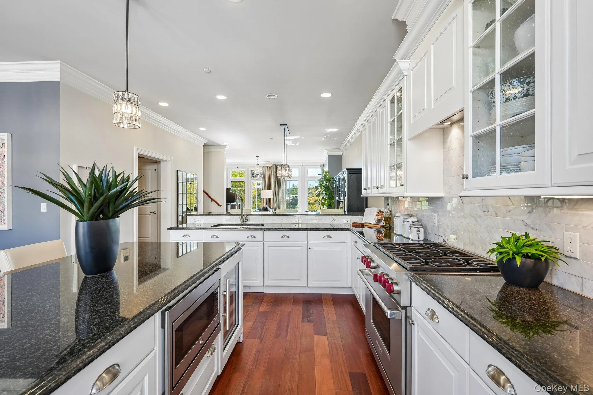 Kitchen with Oversized island Wolf and Subzero appliances, Bosch dishwasher and wine fridge Kitchen with Oversized island Wolf and Subzero appliances, Bosch dishwasher and wine fridge