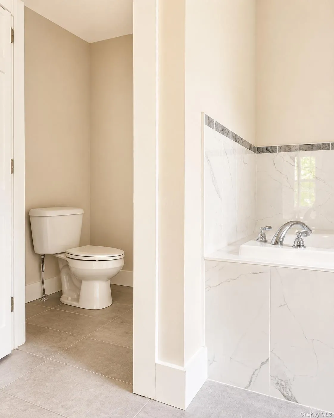 Separate water closet featuring a standard toilet Separate water closet featuring a standard toilet