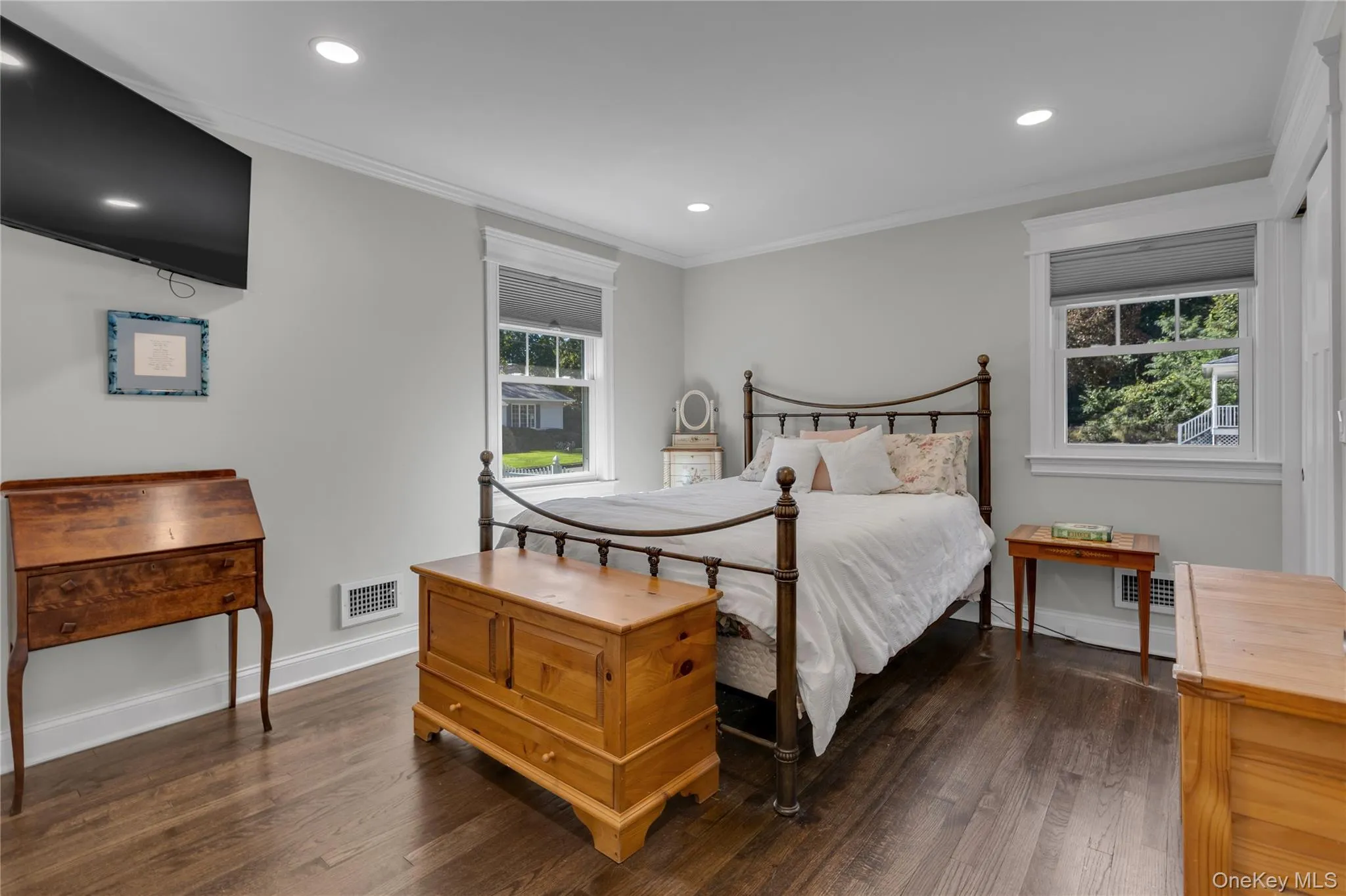 Wood-finish flooring, recessed lighting, and crown molding Wood-finish flooring, recessed lighting, and crown molding