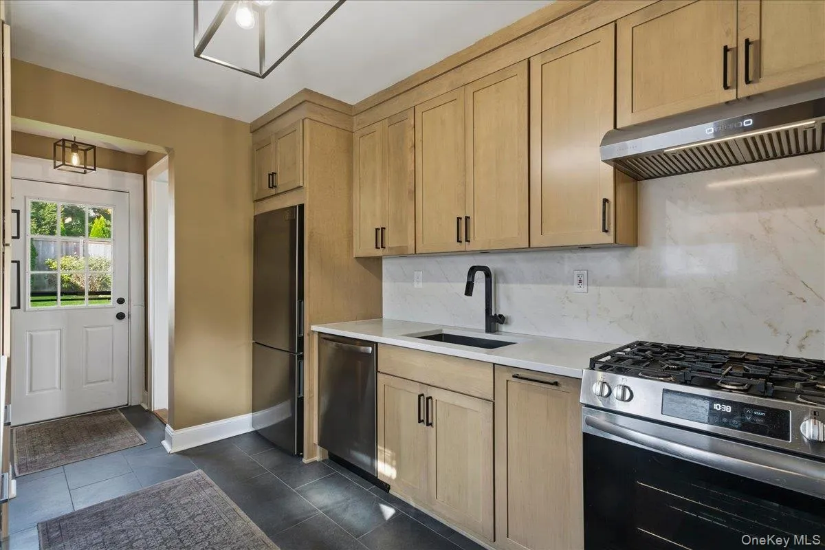 With slate tile flooring and SS appliances With slate tile flooring and SS appliances
