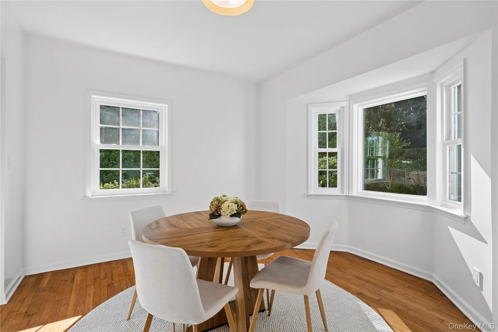 Dining Room enjoys sunlight from large windows - South & West facing exposures Dining Room enjoys sunlight from large windows - South & West facing exposures