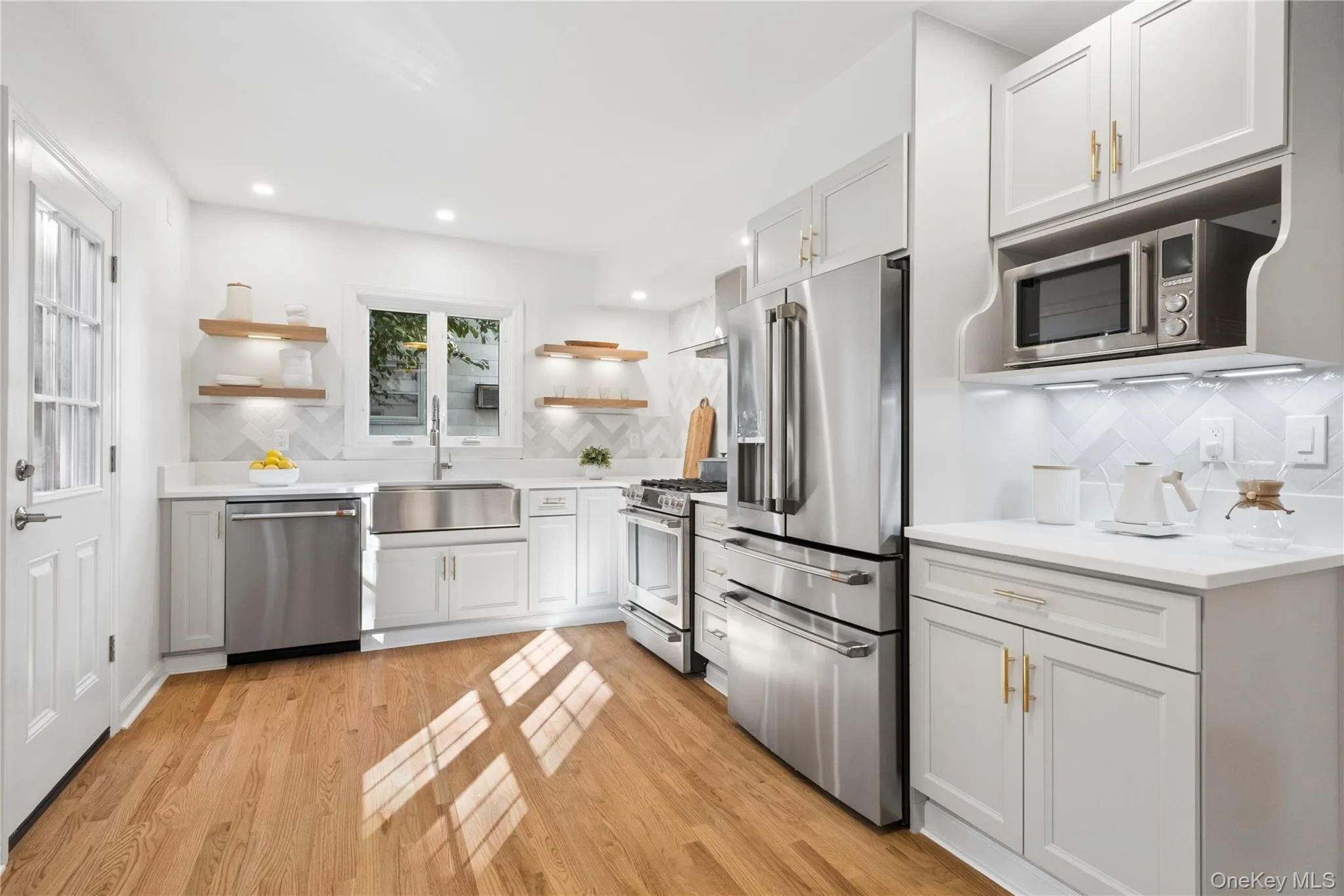 ALL NEW KITCHEN w/ attractive backsplash and new stainless steel Cafe appliances ALL NEW KITCHEN w/ attractive backsplash and new stainless steel Cafe appliances