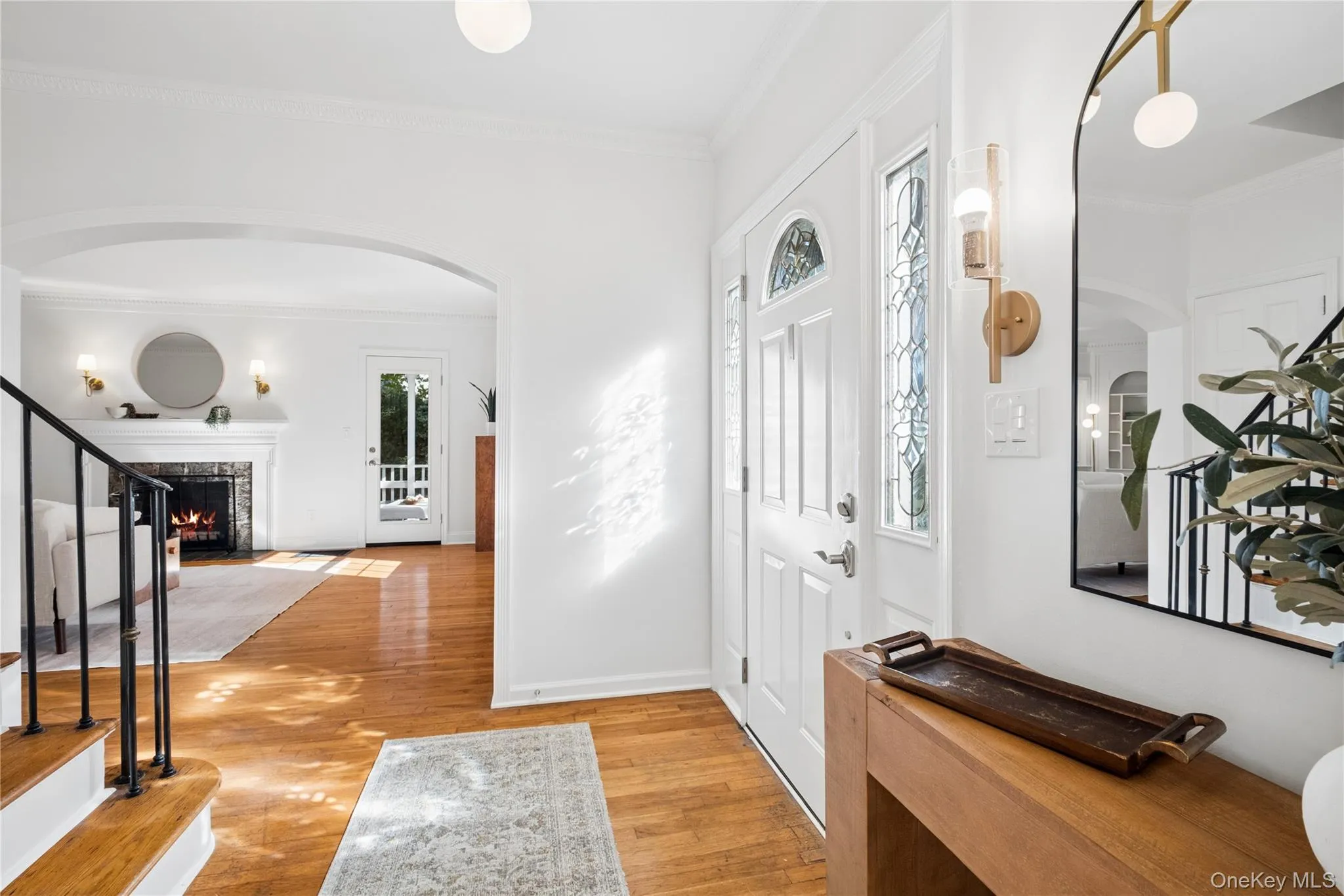 entrance foyer with a view of the living room entrance foyer with a view of the living room