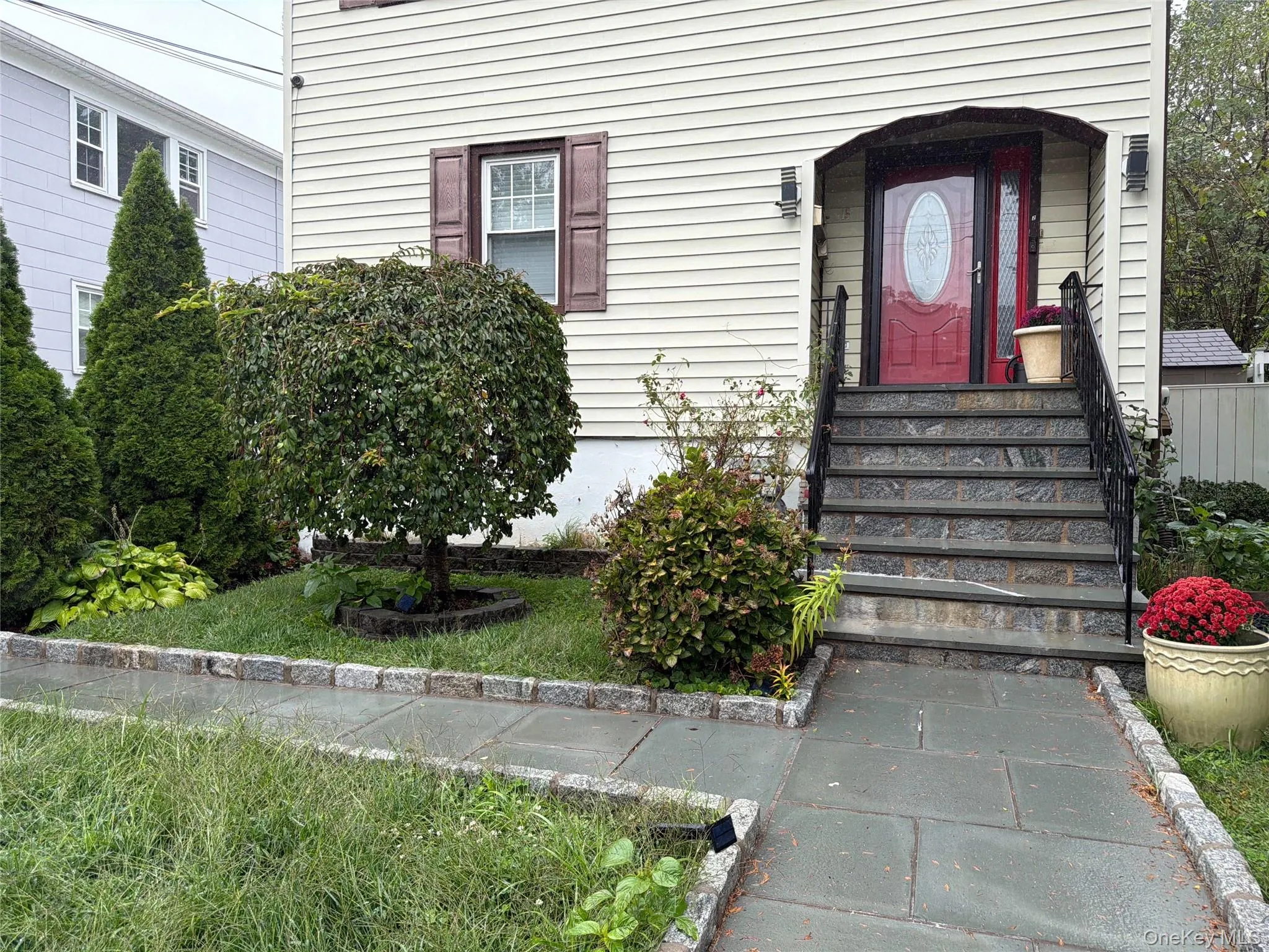 Cream siding exterior with brown shutters Cream siding exterior with brown shutters