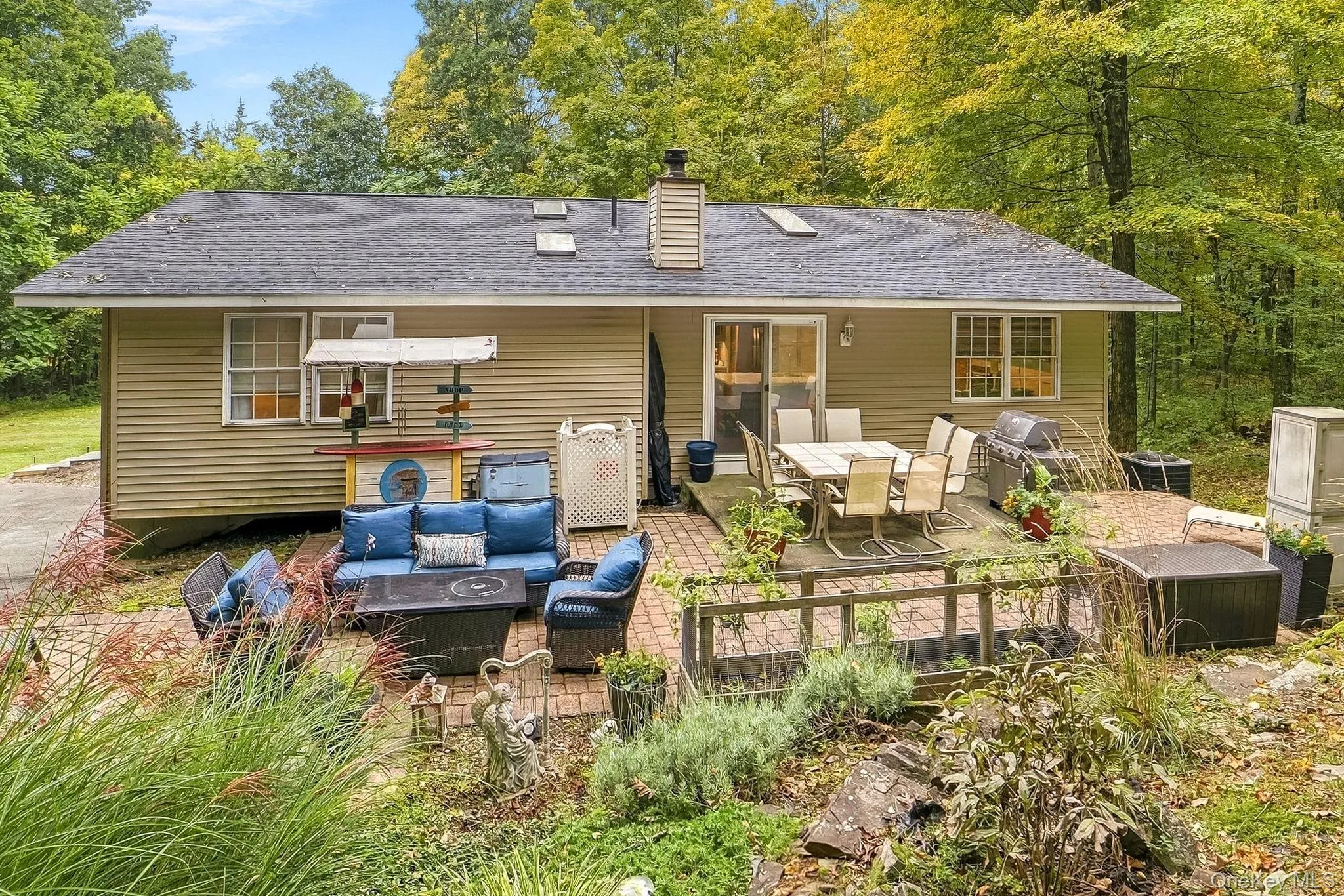 Exterior with horizontal siding, a dark shingle new roof, and patio Exterior with horizontal siding, a dark shingle new roof, and patio