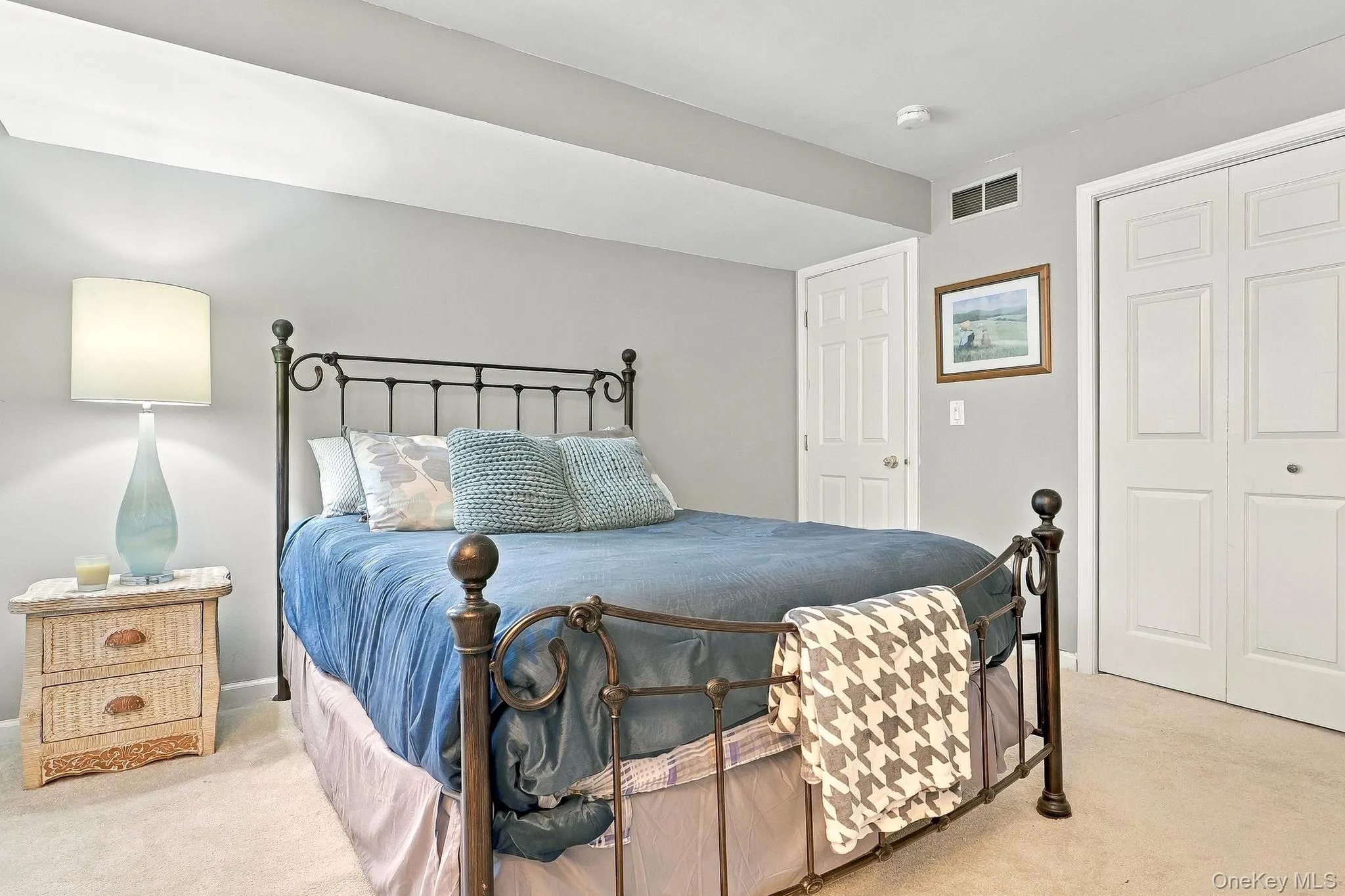 Plush carpeting, neutral wall color, and a white six-panel door Plush carpeting, neutral wall color, and a white six-panel door