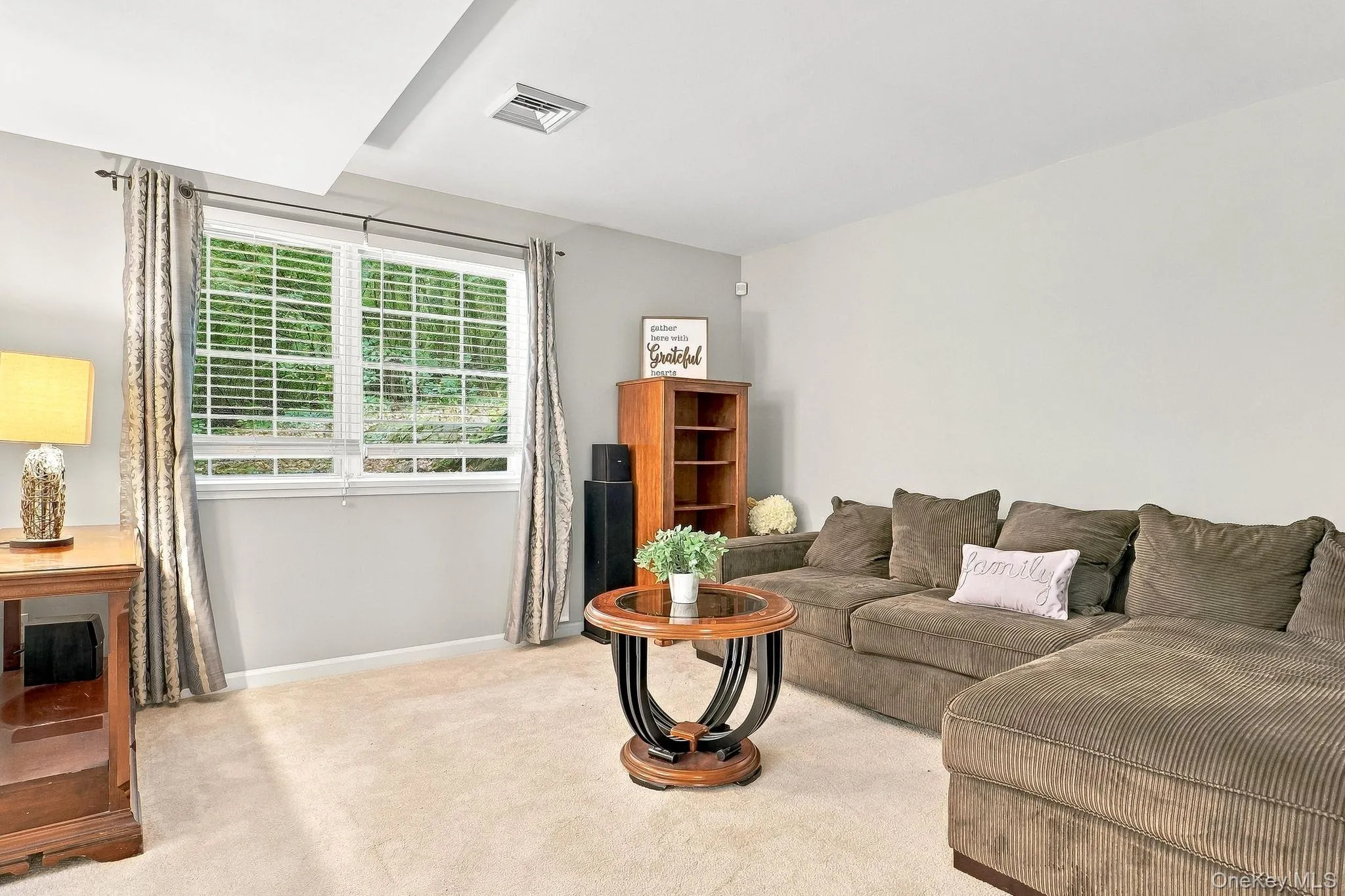 Recessed lighting illuminates the space, featuring light-colored wall paint and light-toned carpeting Recessed lighting illuminates the space, featuring light-colored wall paint and light-toned carpeting