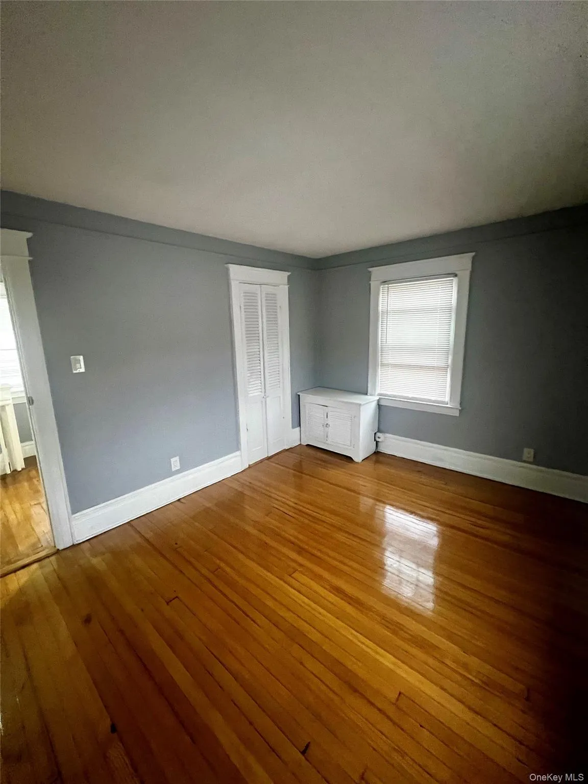 Unfurnished bedroom featuring light wood finished floors and a closet Unfurnished bedroom featuring light wood finished floors and a closet