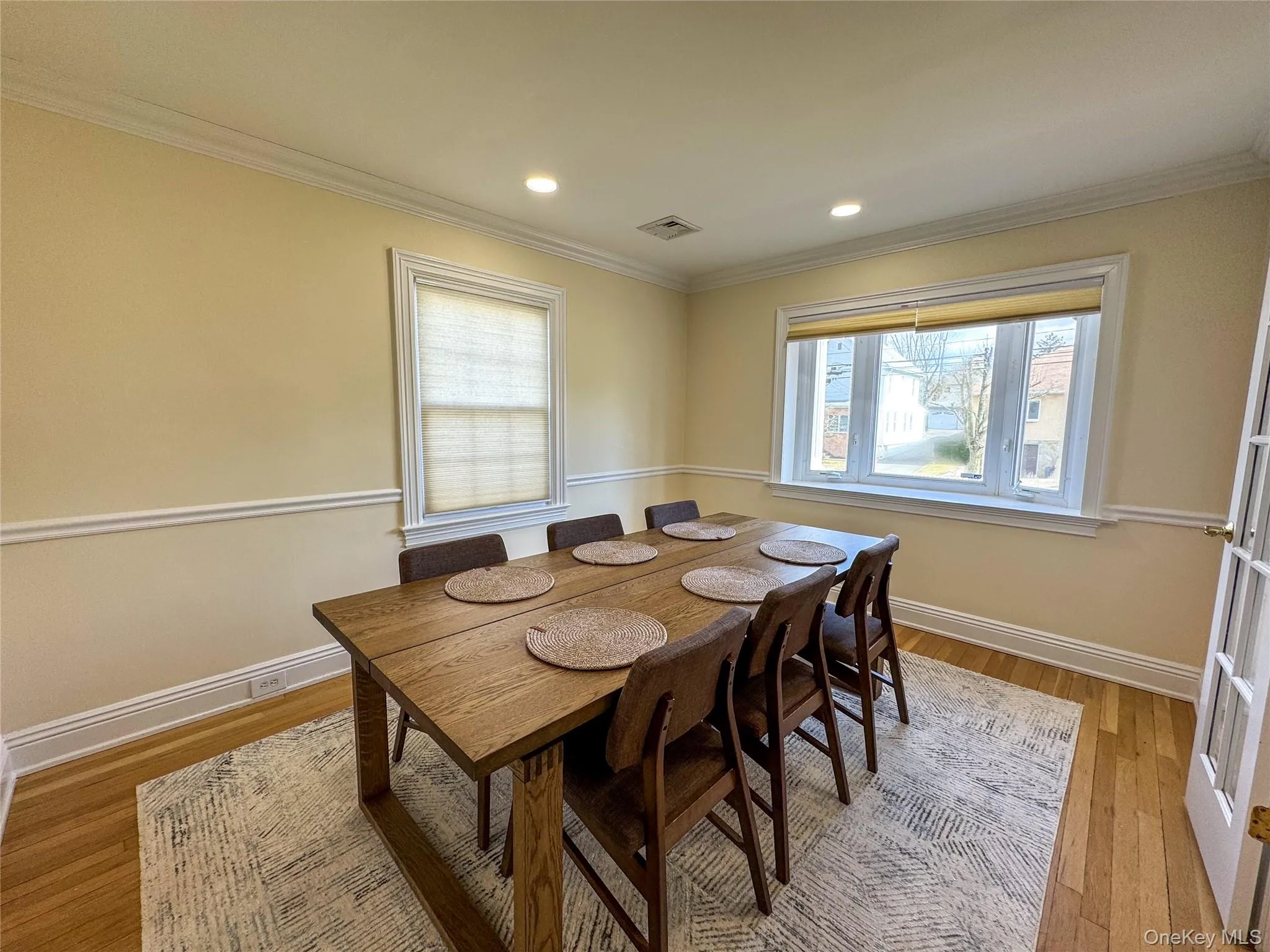 Hardwood flooring throughout, recessed lighting, crown molding, and chair rail detailing Hardwood flooring throughout, recessed lighting, crown molding, and chair rail detailing
