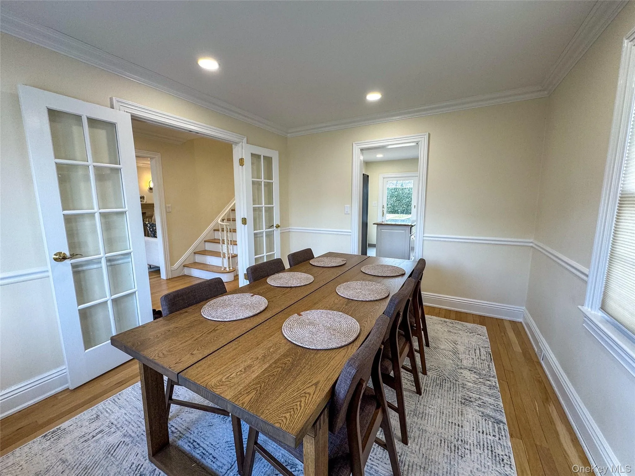 Hardwood flooring, recessed lighting, and crown molding Hardwood flooring, recessed lighting, and crown molding