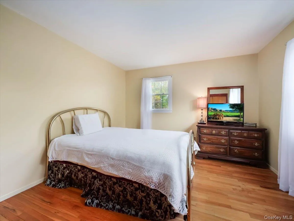 Wood-finish flooring and a single-pane window Wood-finish flooring and a single-pane window