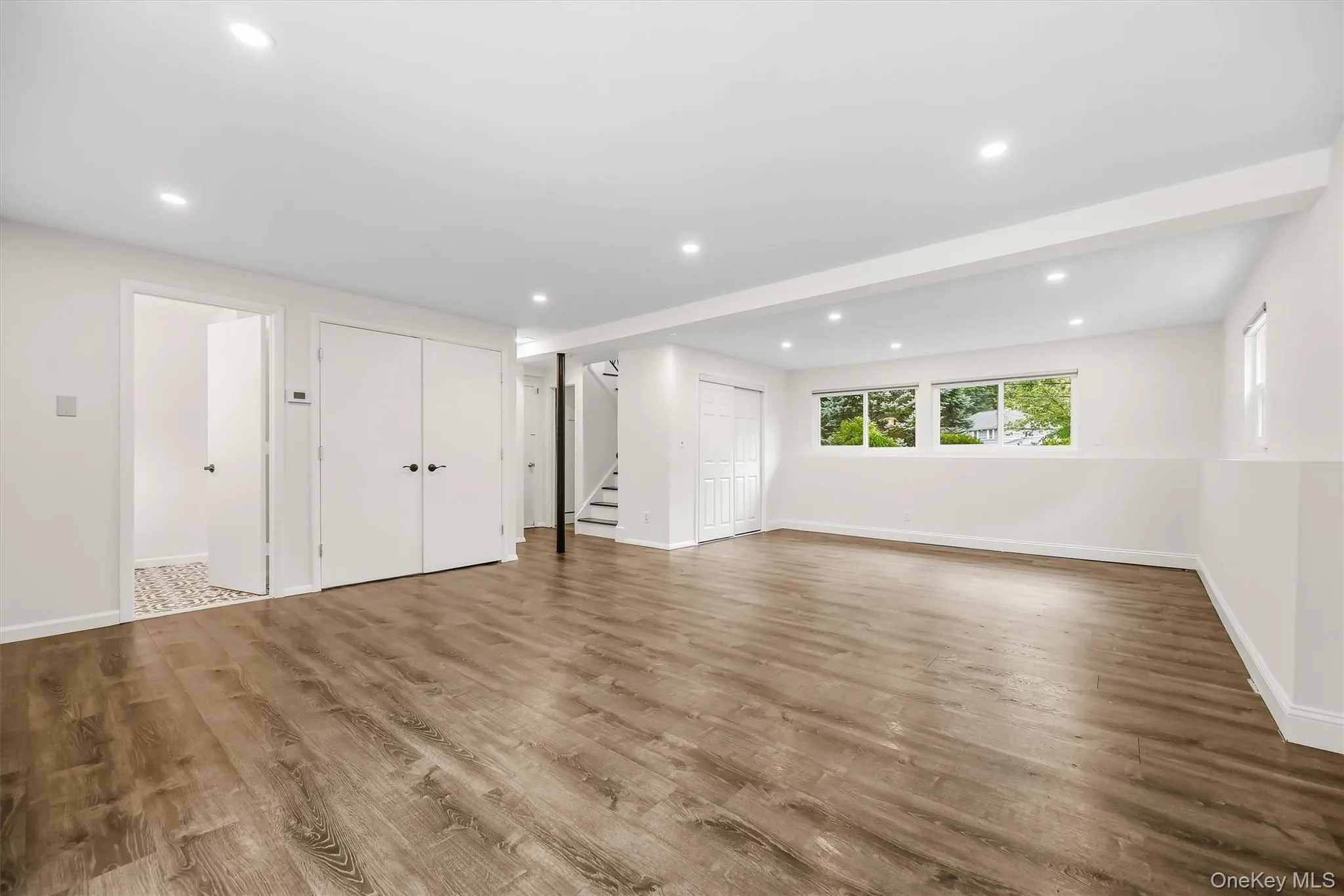 Large family room with full bath, bedroom & slider to covered patio Large family room with full bath, bedroom & slider to covered patio
