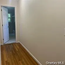 Wood-finish flooring with light-toned walls Wood-finish flooring with light-toned walls