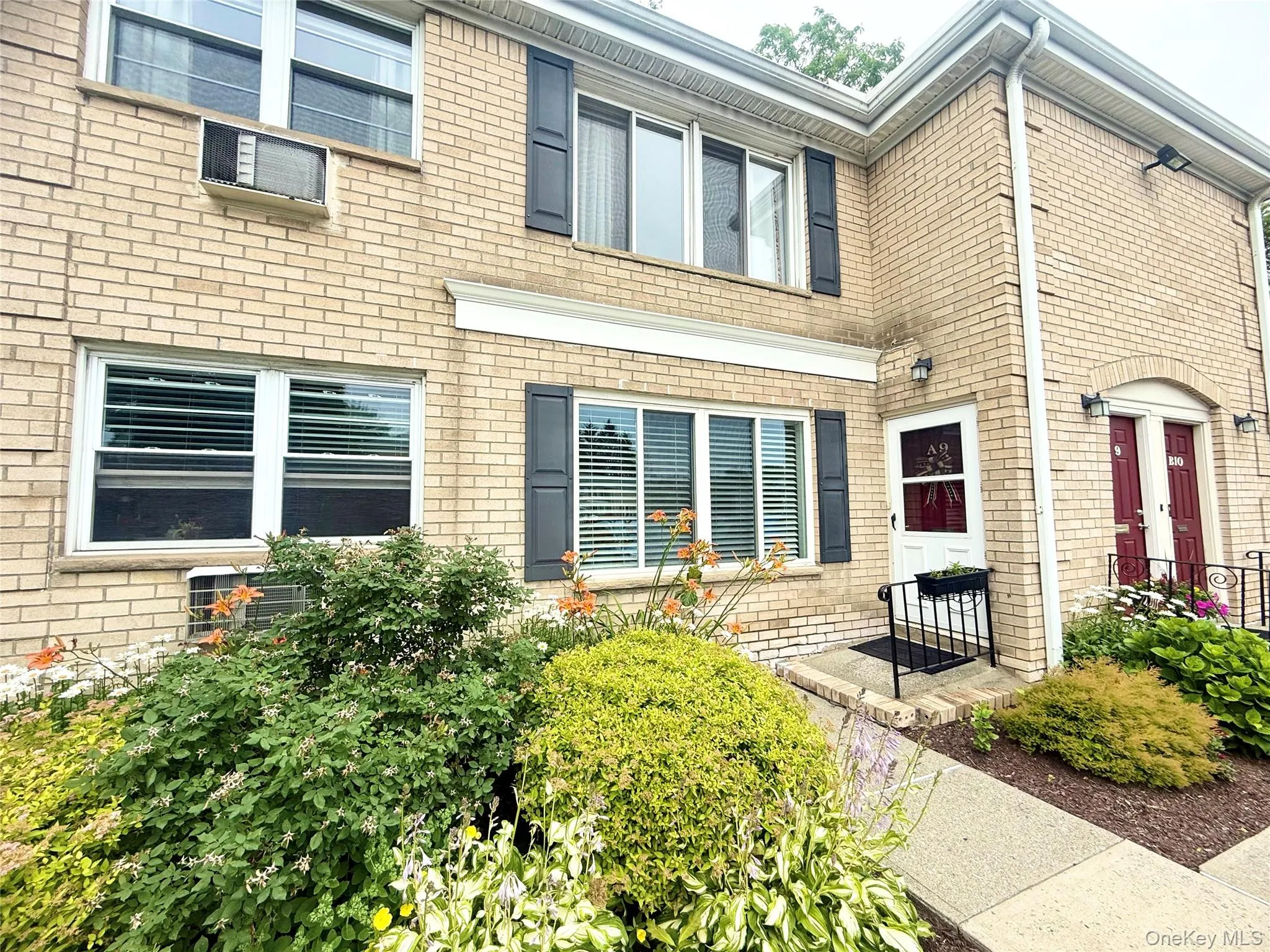 Doorway to property with brick siding Doorway to property with brick siding