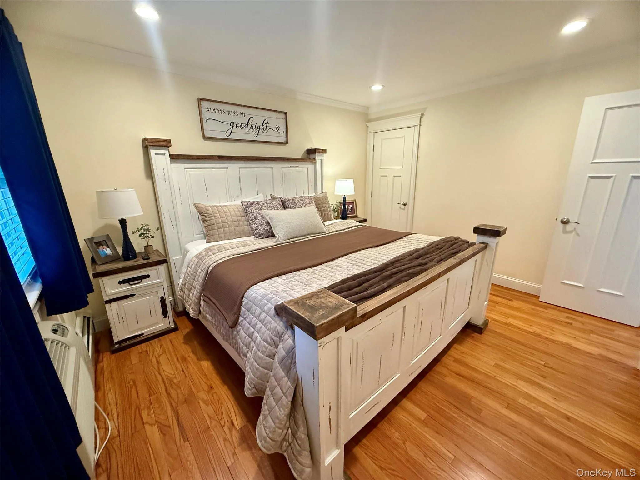 Bedroom with crown molding, light wood-type flooring, and recessed lighting Bedroom with crown molding, light wood-type flooring, and recessed lighting