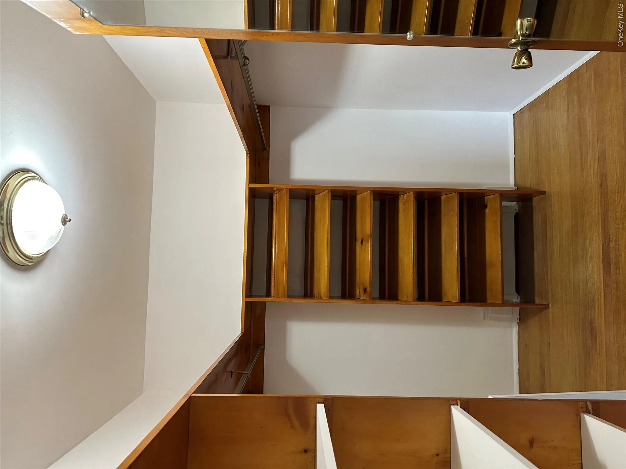 Spacious closet with wood finished floors Spacious closet with wood finished floors