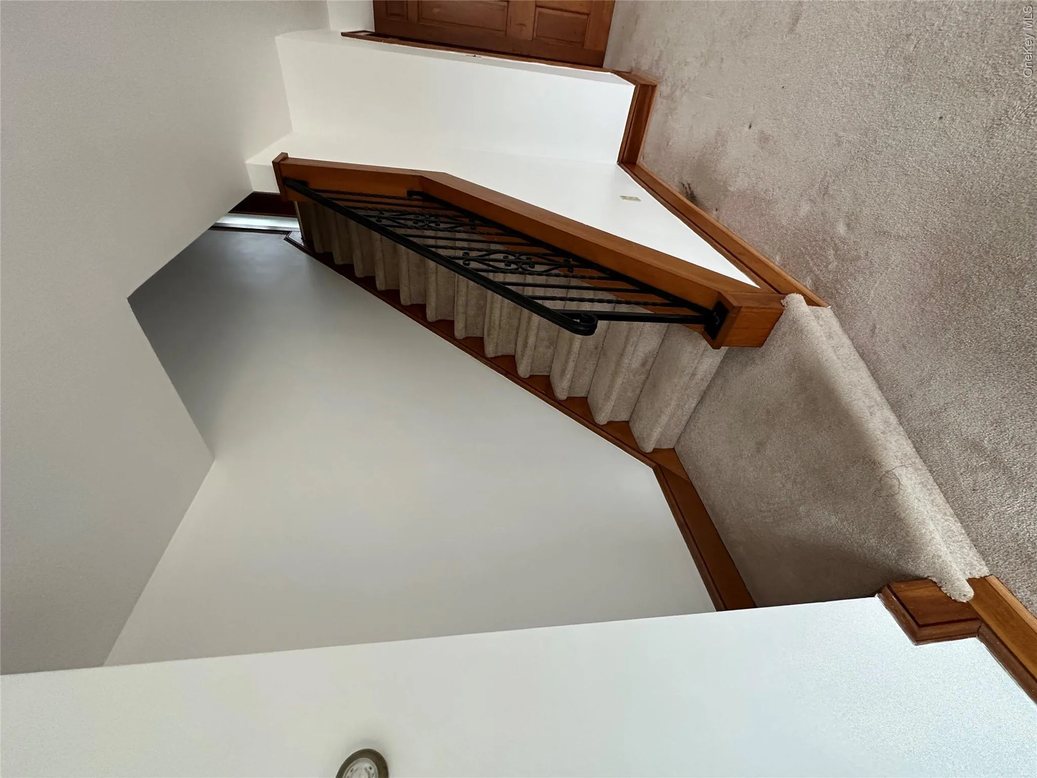 Stairway featuring carpet flooring and baseboards Stairway featuring carpet flooring and baseboards