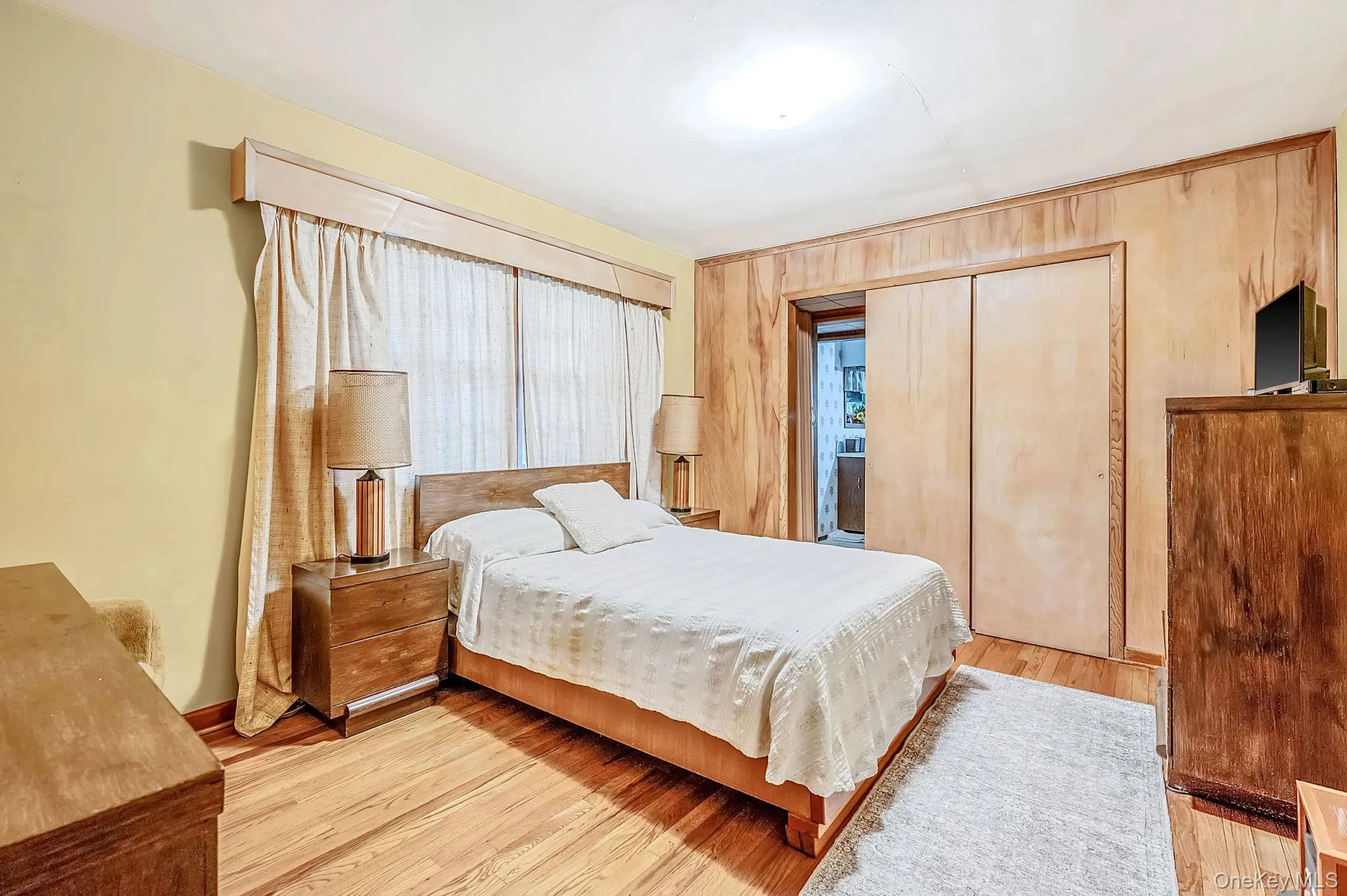 Primary bedroom with hardwood floors Primary bedroom with hardwood floors