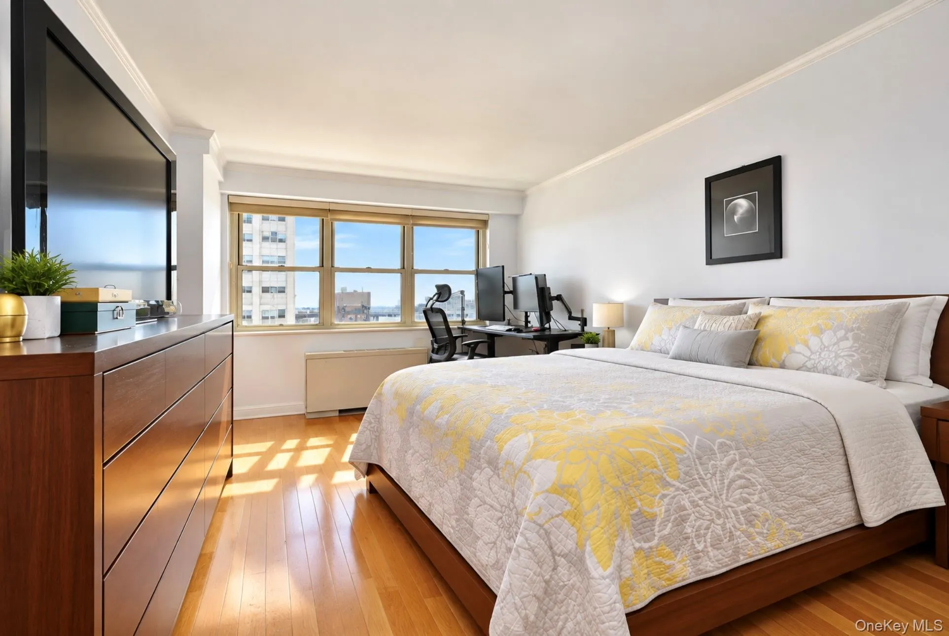 Wood-finish flooring, crown molding, and large windows with horizontal blinds Wood-finish flooring, crown molding, and large windows with horizontal blinds