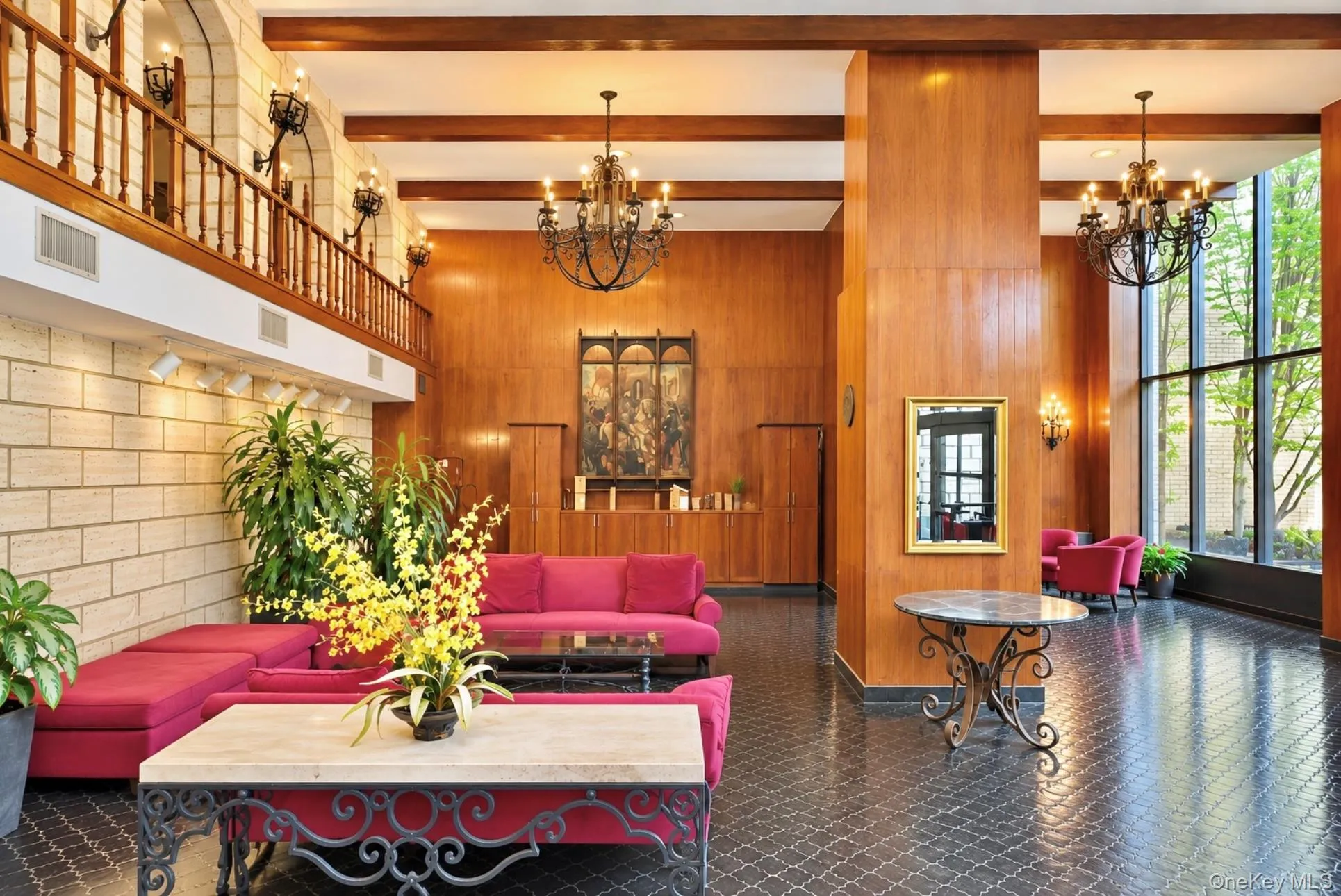 Two-story lobby featuring wood paneling and stone block walls Two-story lobby featuring wood paneling and stone block walls