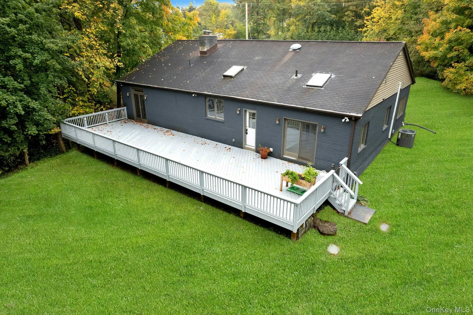 Oversized deck with yard access. Oversized deck with yard access.