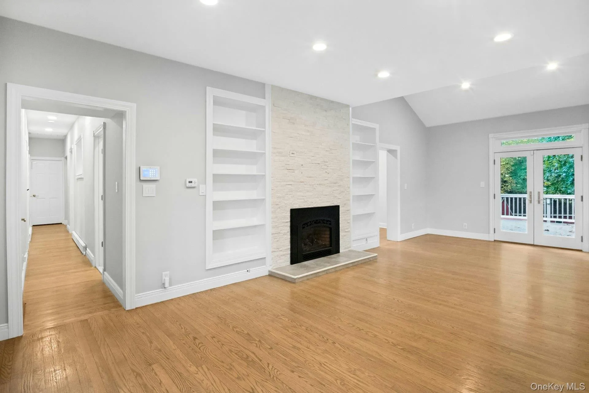 Ceiling to floor stone gas fireplace. Ceiling to floor stone gas fireplace.