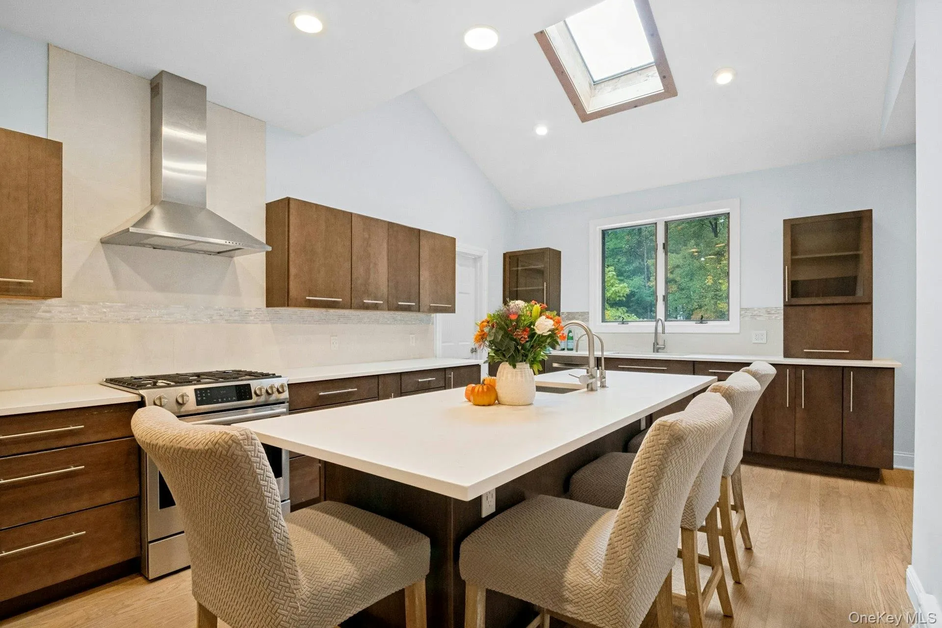 An oversized quartz kitchen island that handles both meal prep and homework. An oversized quartz kitchen island that handles both meal prep and homework.