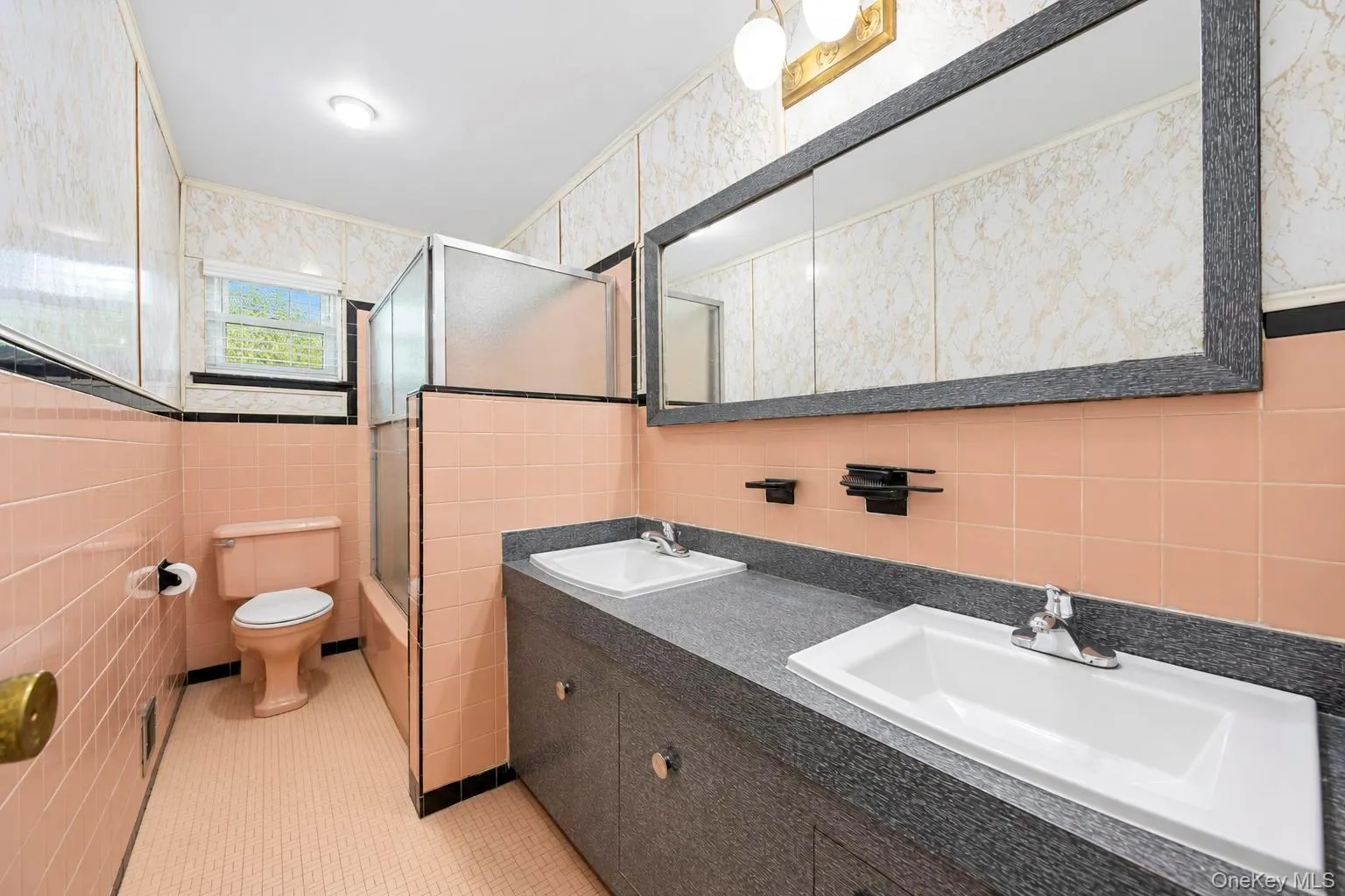 Dual vanity with integrated sinks, full-width mirror, and built-in medicine cabinets Dual vanity with integrated sinks, full-width mirror, and built-in medicine cabinets