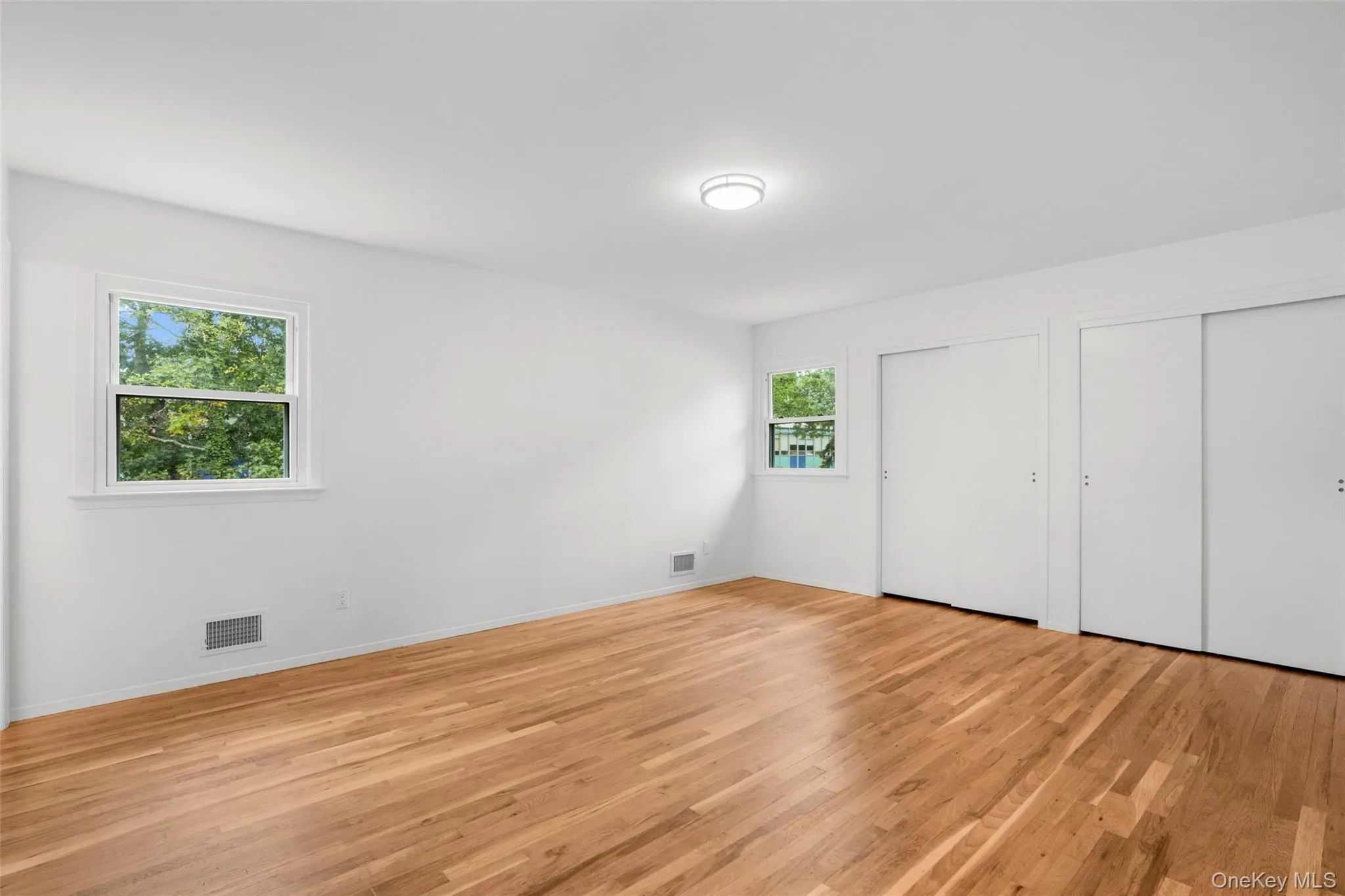 A restful primary suite with dual closets. A restful primary suite with dual closets.