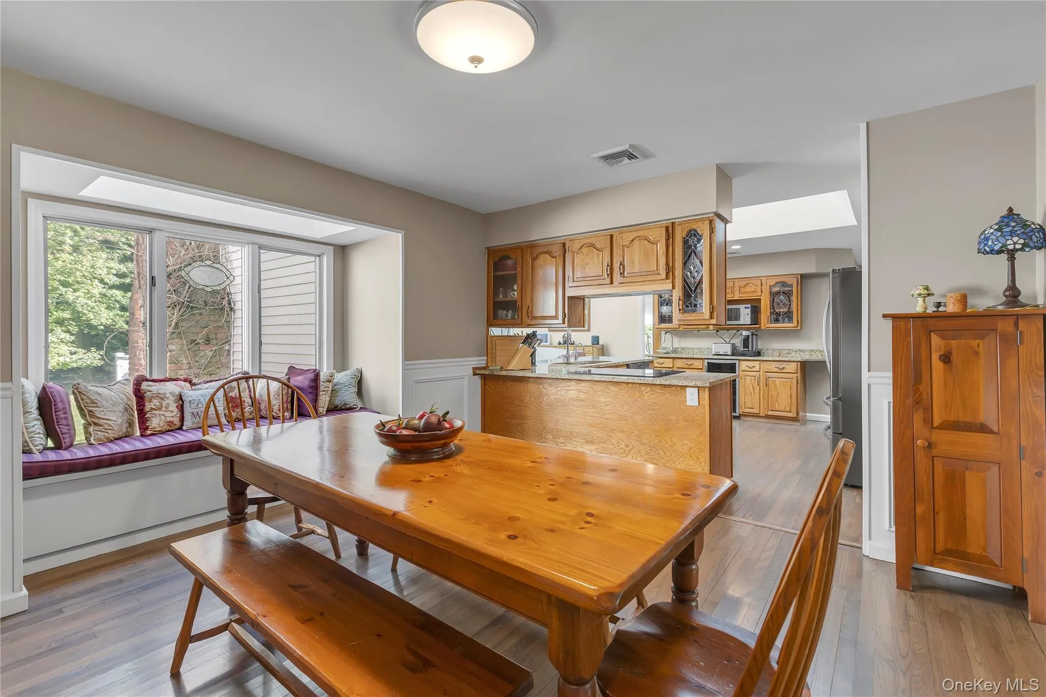 Dining Room with pass through window to expansive kitchen Dining Room with pass through window to expansive kitchen