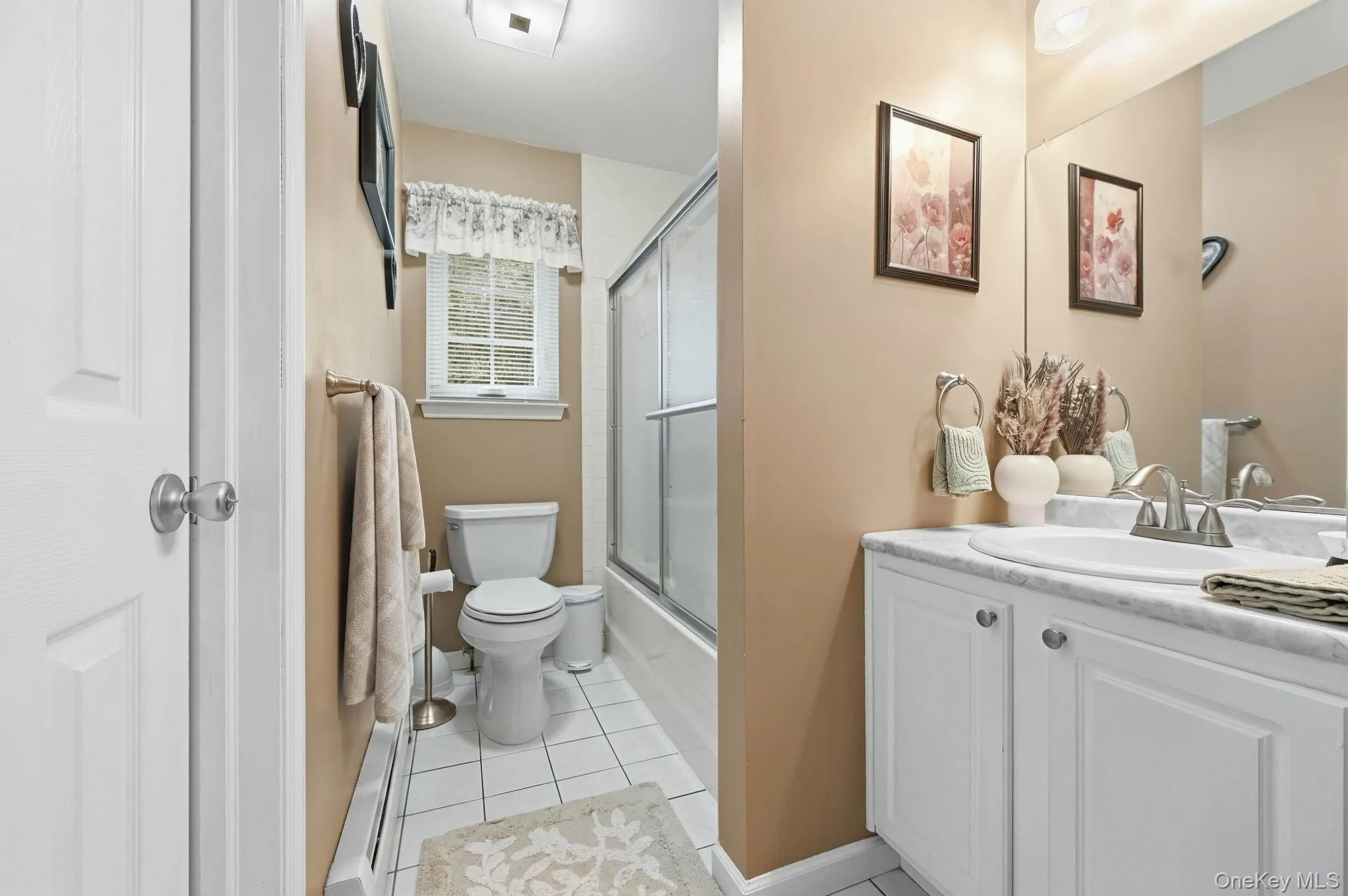 A second full bathroom adds convenience to the home's three-bedroom layout. A second full bathroom adds convenience to the home's three-bedroom layout.