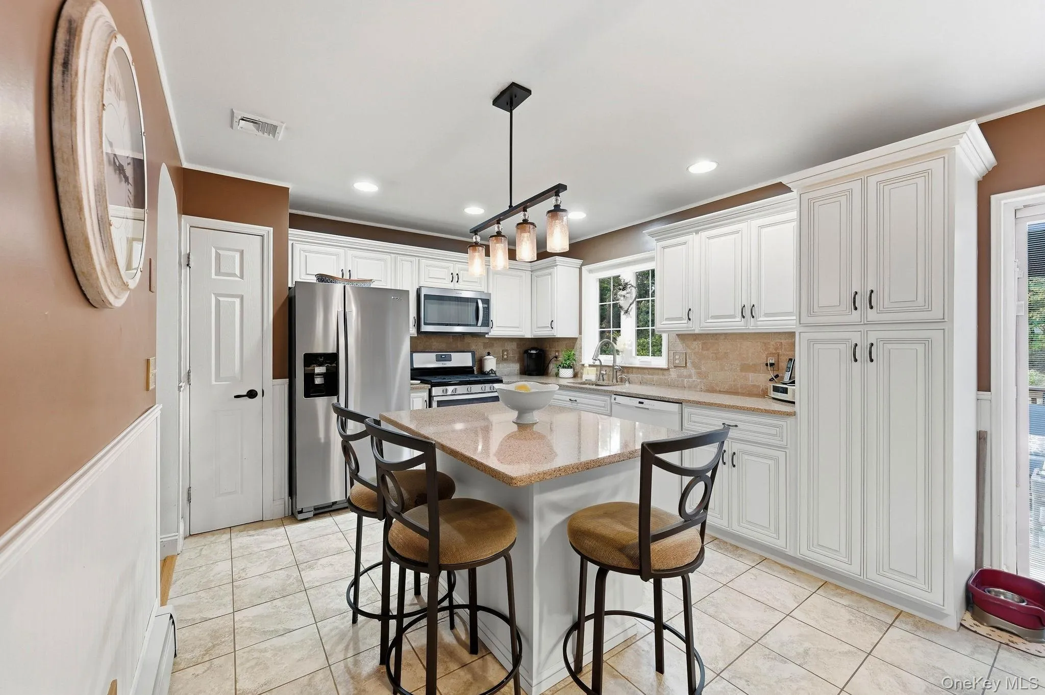 Thoughtfully designed cabinetry and counter space make this kitchen ideal for everyday cooking and entertaining. Thoughtfully designed cabinetry and counter space make this kitchen ideal for everyday cooking and entertaining.