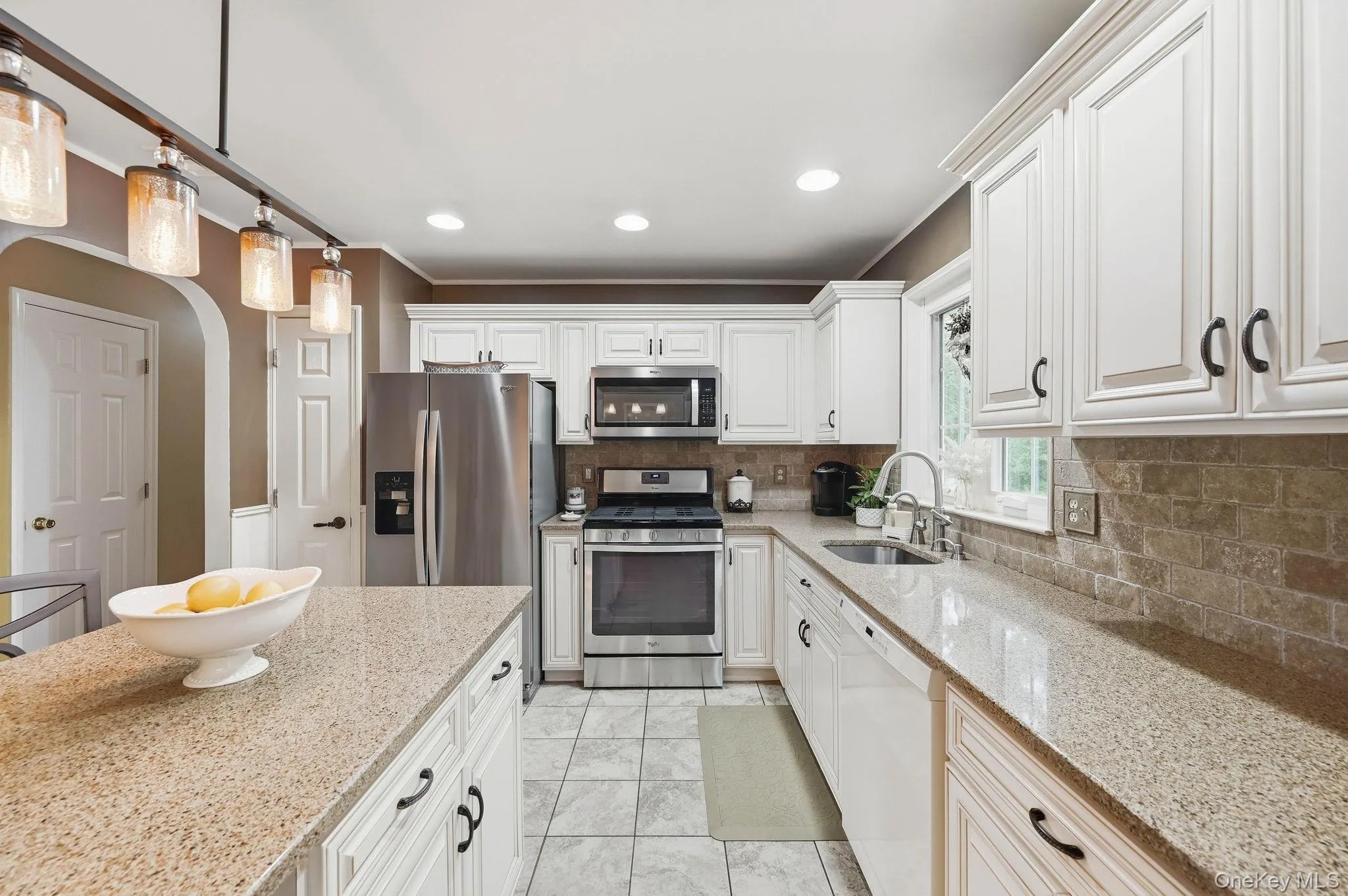An easy flow between the kitchen and dining areas makes gathering and entertaining effortless. An easy flow between the kitchen and dining areas makes gathering and entertaining effortless.