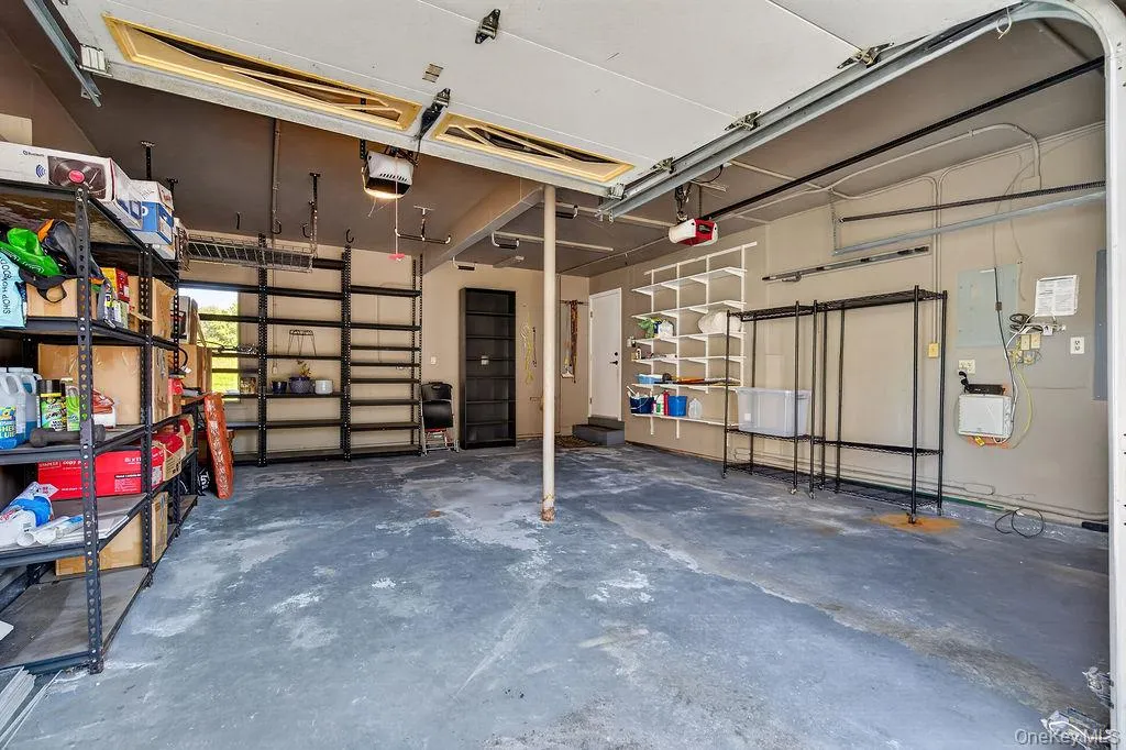 This garage comfortably fits 2 cars, even that big SUV, and you still have plenty of space for storage This garage comfortably fits 2 cars, even that big SUV, and you still have plenty of space for storage