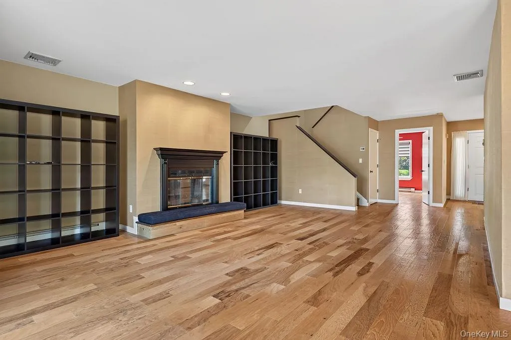 Expansive living room with wood burning fireplace Expansive living room with wood burning fireplace