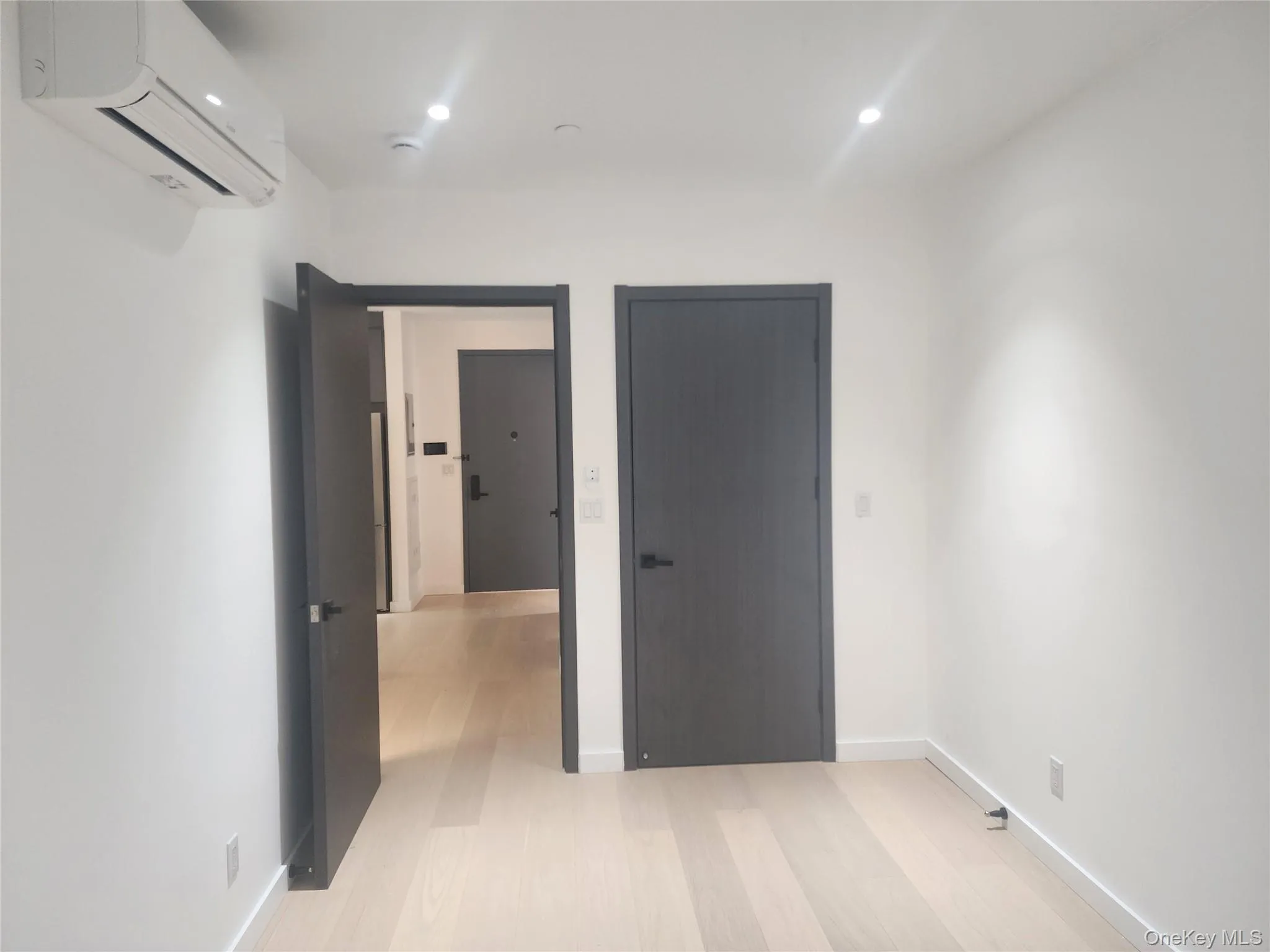 Light wood-finish flooring with white walls Light wood-finish flooring with white walls
