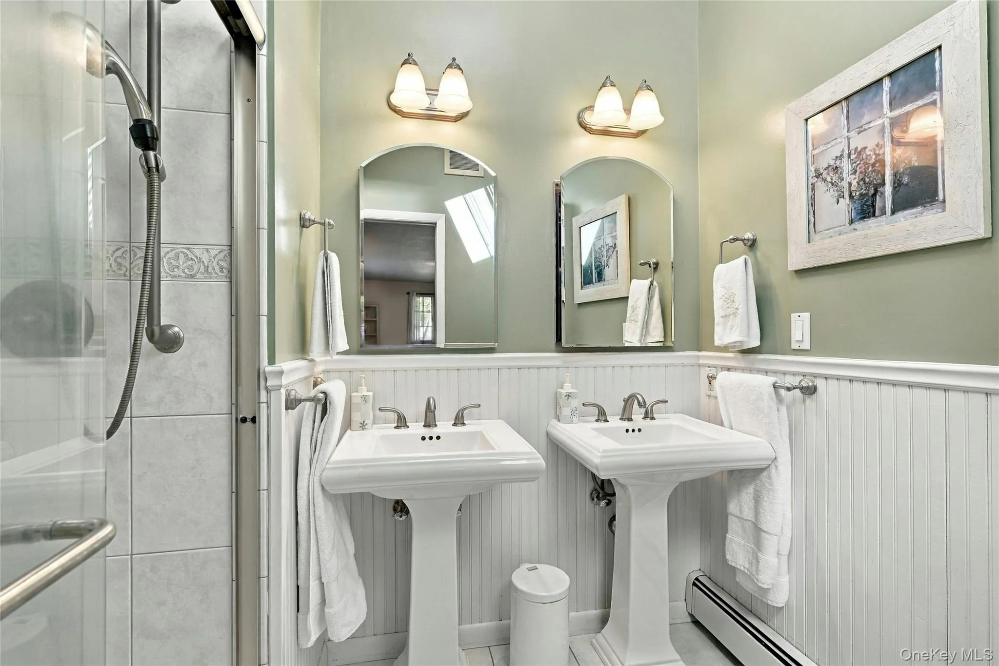 Primary Bath with dual sinks and skylight Primary Bath with dual sinks and skylight