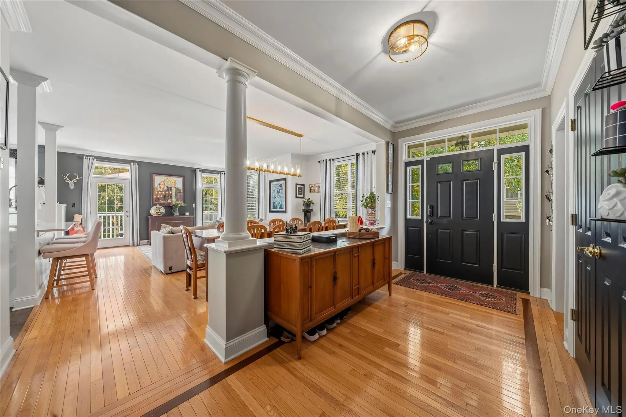 You're barely in the door and immediately you see this is not your average townhome. Inlaid hardwood floors, crown molding and open space. You're barely in the door and immediately you see this is not your average townhome. Inlaid hardwood floors, crown molding and open space.