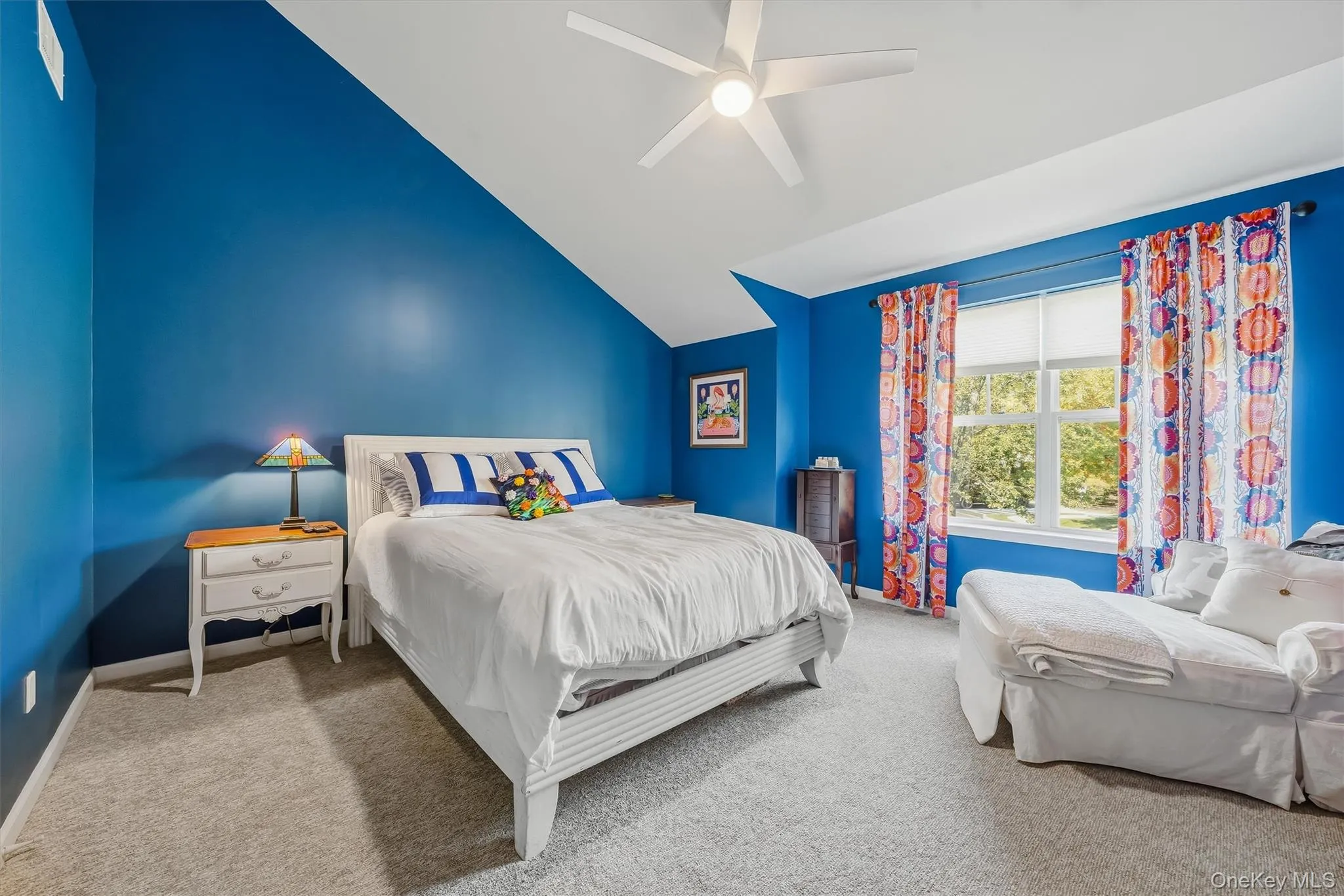 The guest bedroom has a high angled ceiling witih a walk in closet and new carpet. The guest bedroom has a high angled ceiling witih a walk in closet and new carpet.