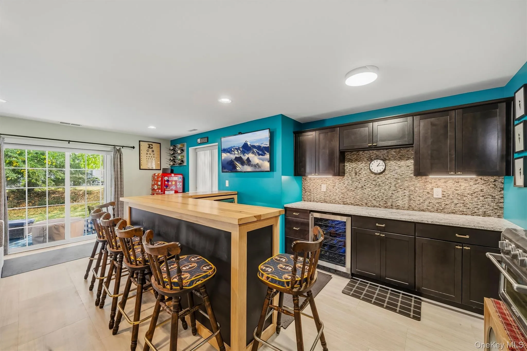 Espresso stained cabinets to hold your barware, a wine refrigerator and a beverage cooler. New floors as well. Espresso stained cabinets to hold your barware, a wine refrigerator and a beverage cooler. New floors as well.